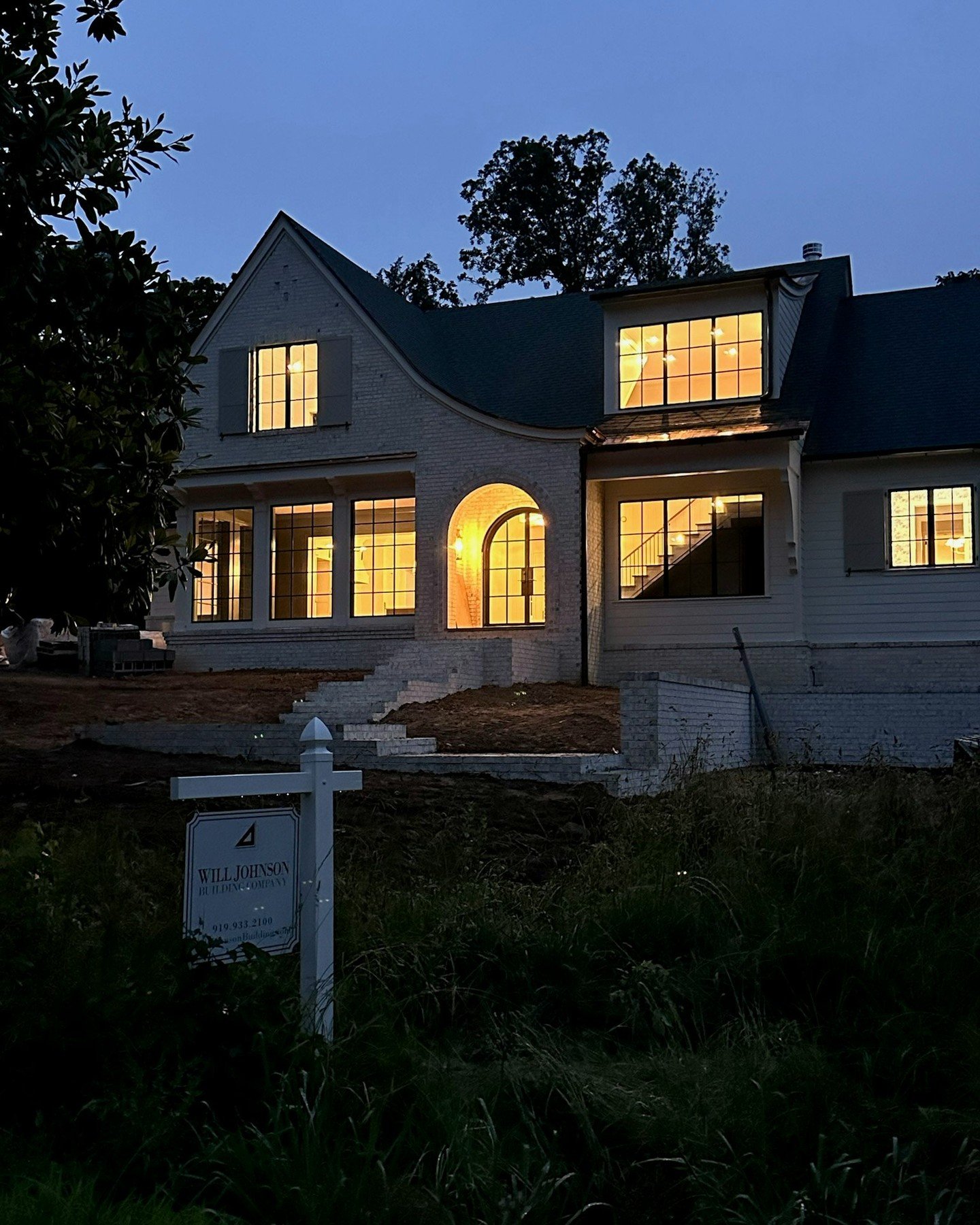 Even mid-construction, moments like this give a glimpse of what&rsquo;s to come. In Chapel Hill, this home is still taking shape, but the warm glow through the windows hints at the spaces that will soon be lived in. Progress you can see &mdash; and f