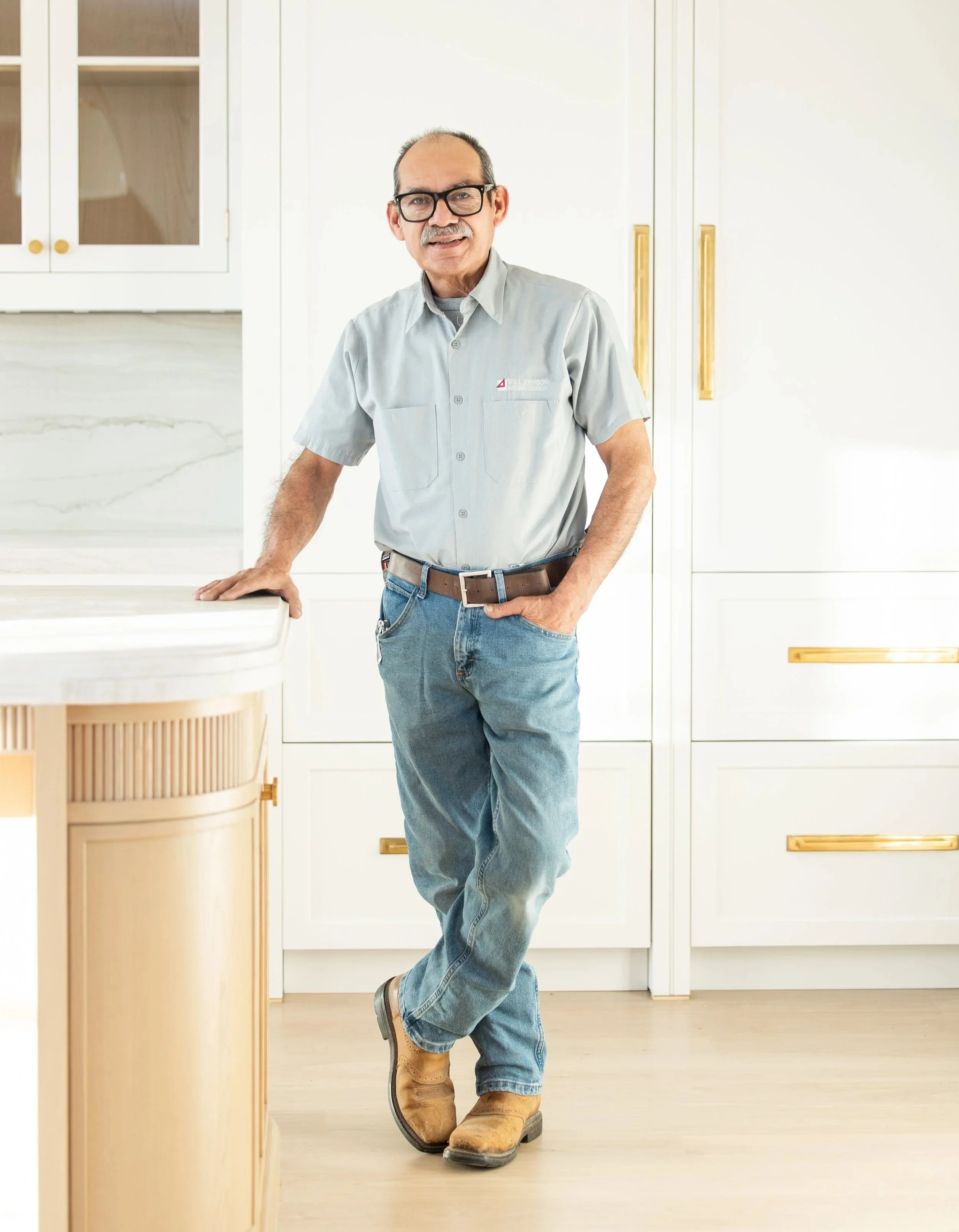 Man using a power drill on a construction site.