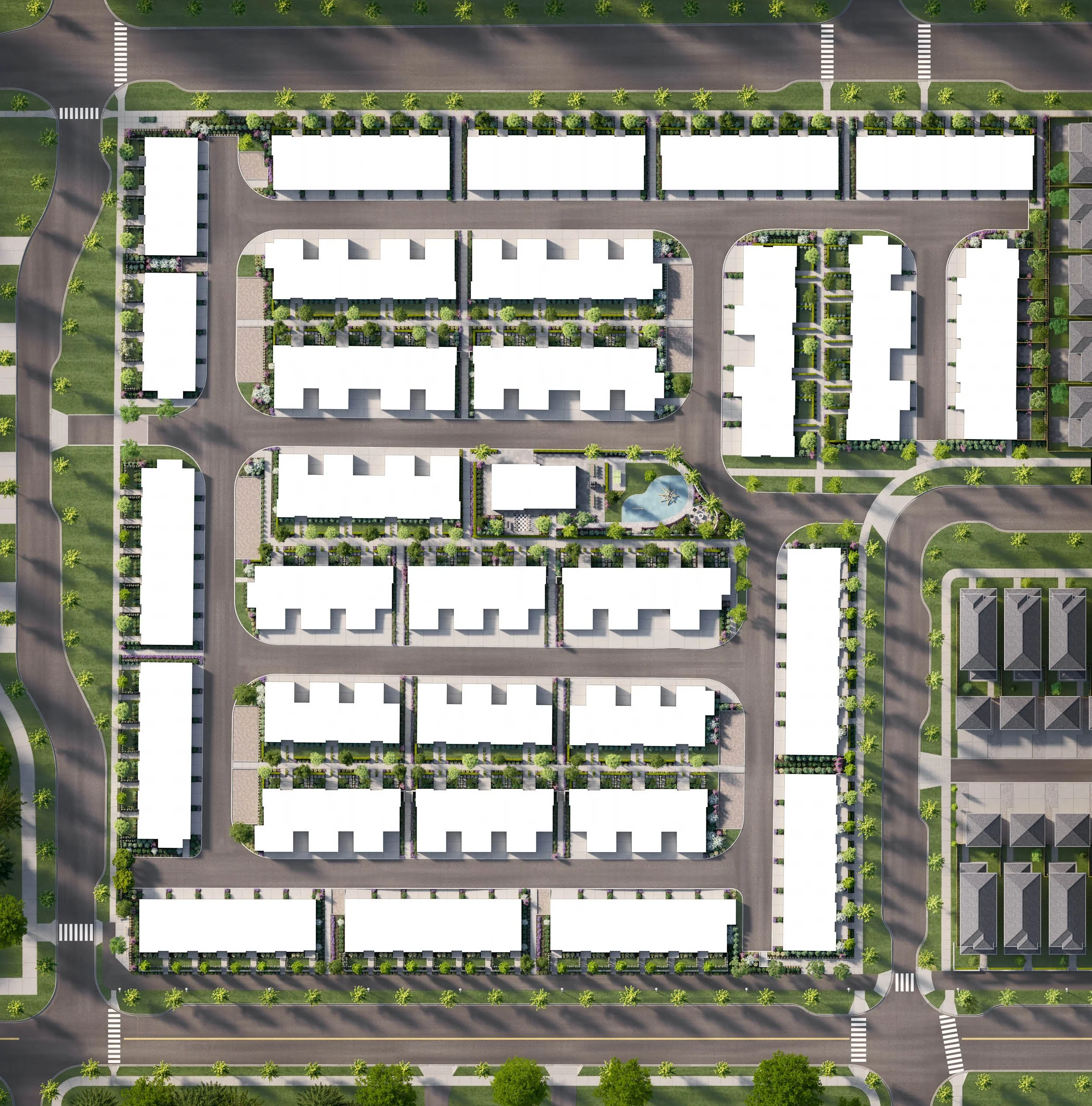 Overhead site plan showing rows of townhome blocks, internal drive aisles, parking and landscaped strips