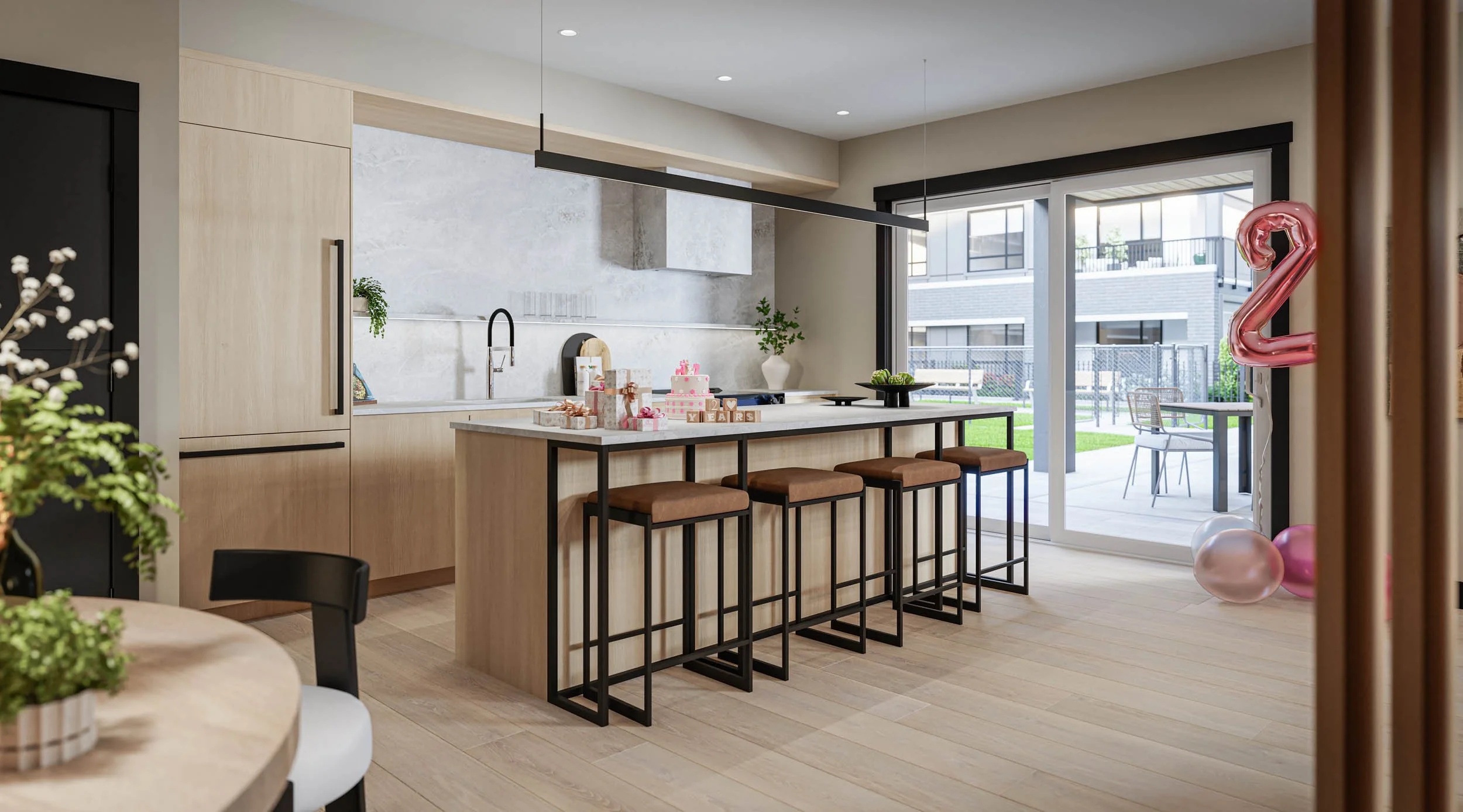 Amenity kitchen with a large island and bar stools, set up for a party, opening to the courtyard