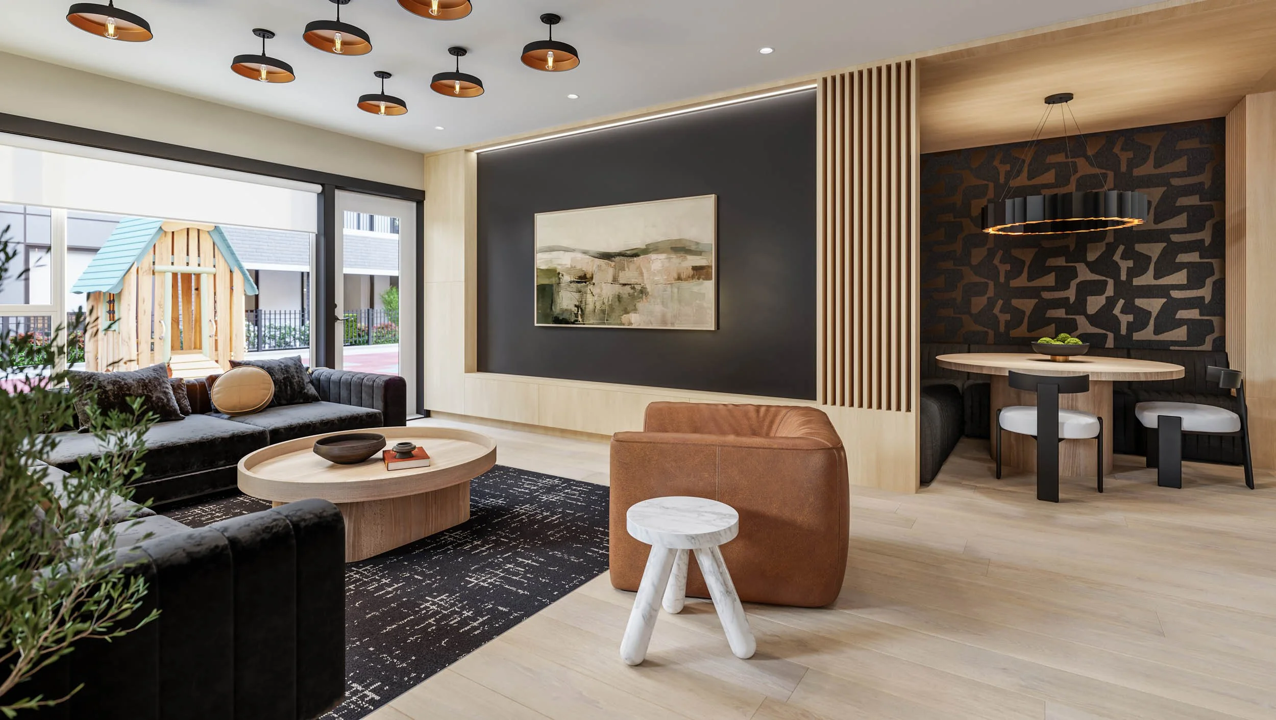 Amenity lounge with a sectional sofa, dining nook and patterned feature wall