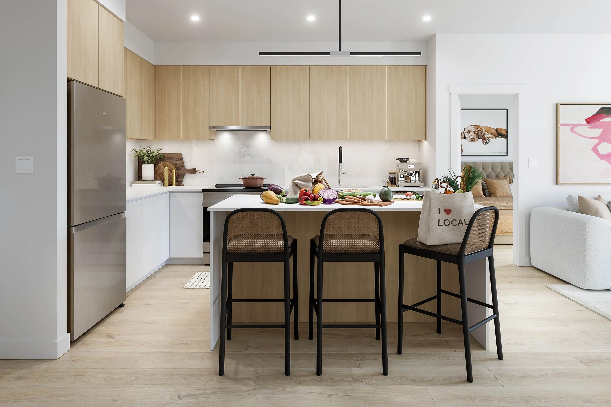 Suite kitchen in the light scheme, with pale oak upper cabinets, a white island and cane bar stools