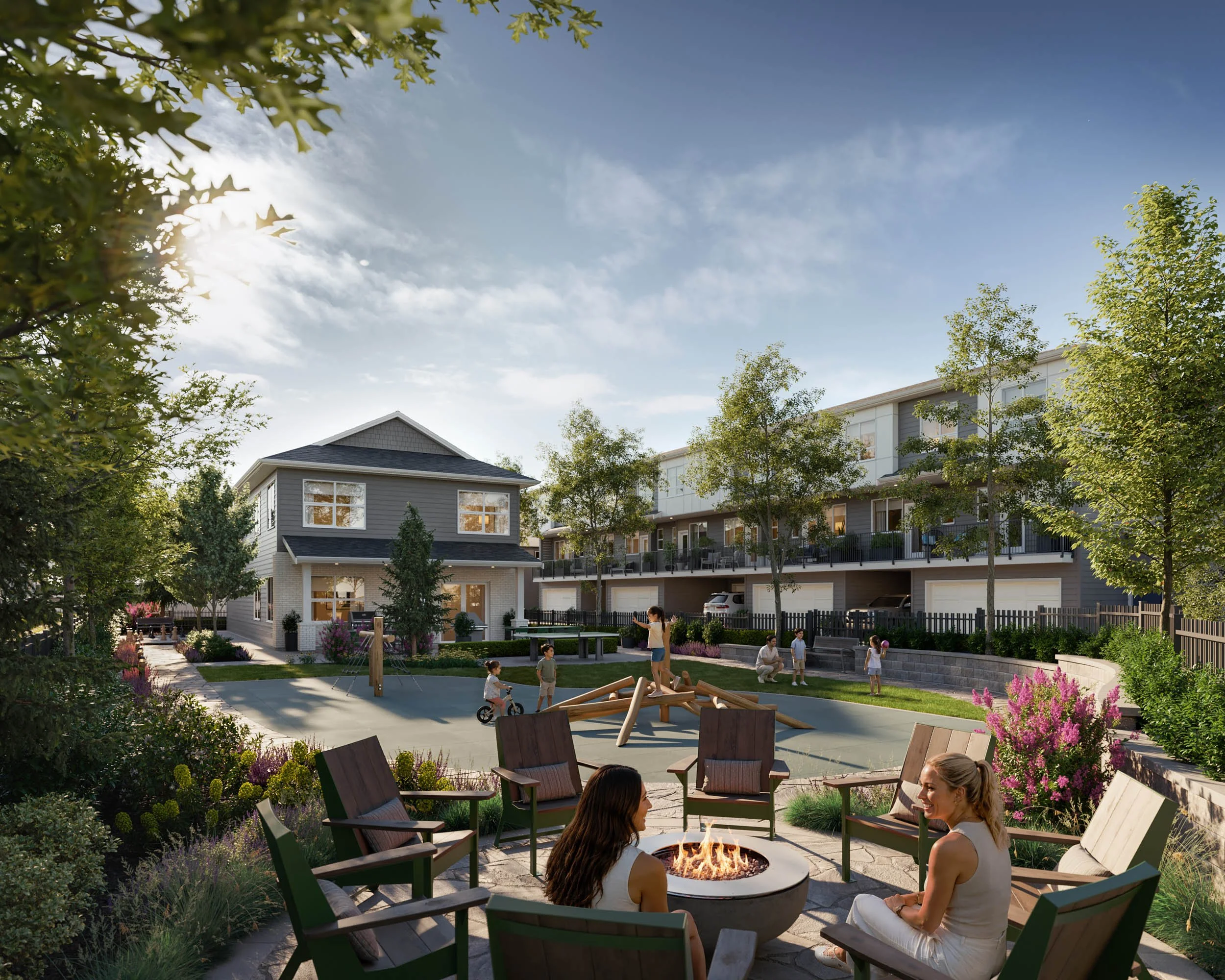 Firepit lounge with wood chairs at golden hour, a pool deck and play area beyond, and the amenity building behind the trees