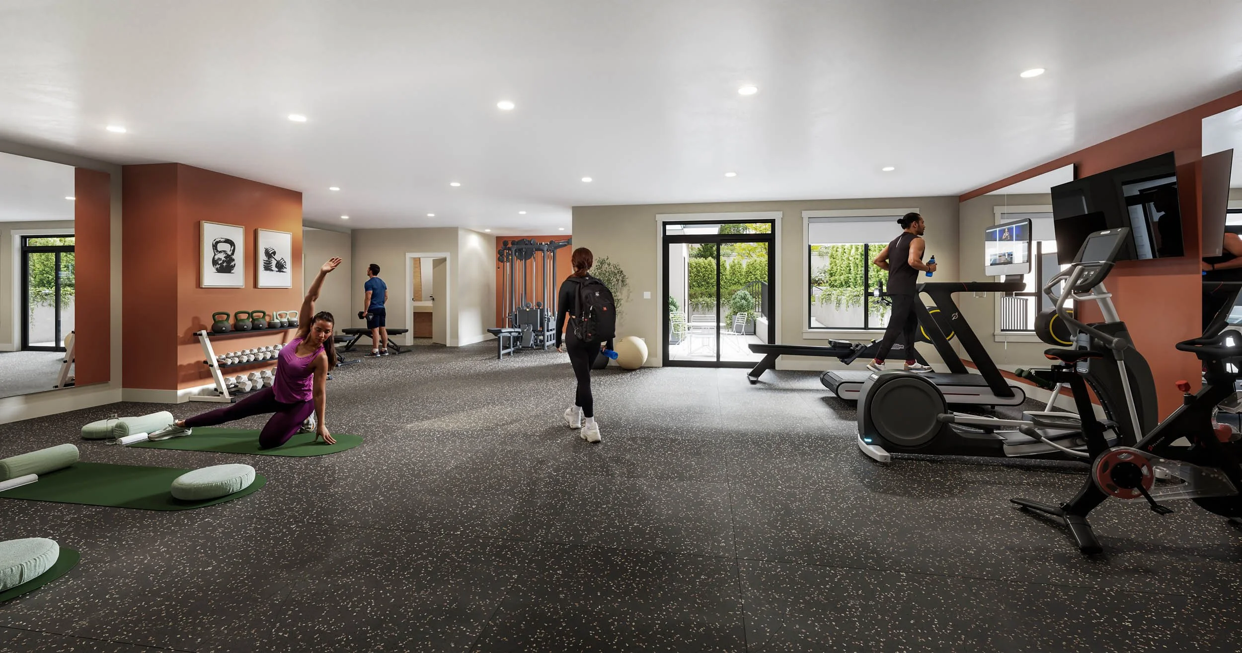 Fitness room with cardio machines, free weights and a mat area, opening to a garden