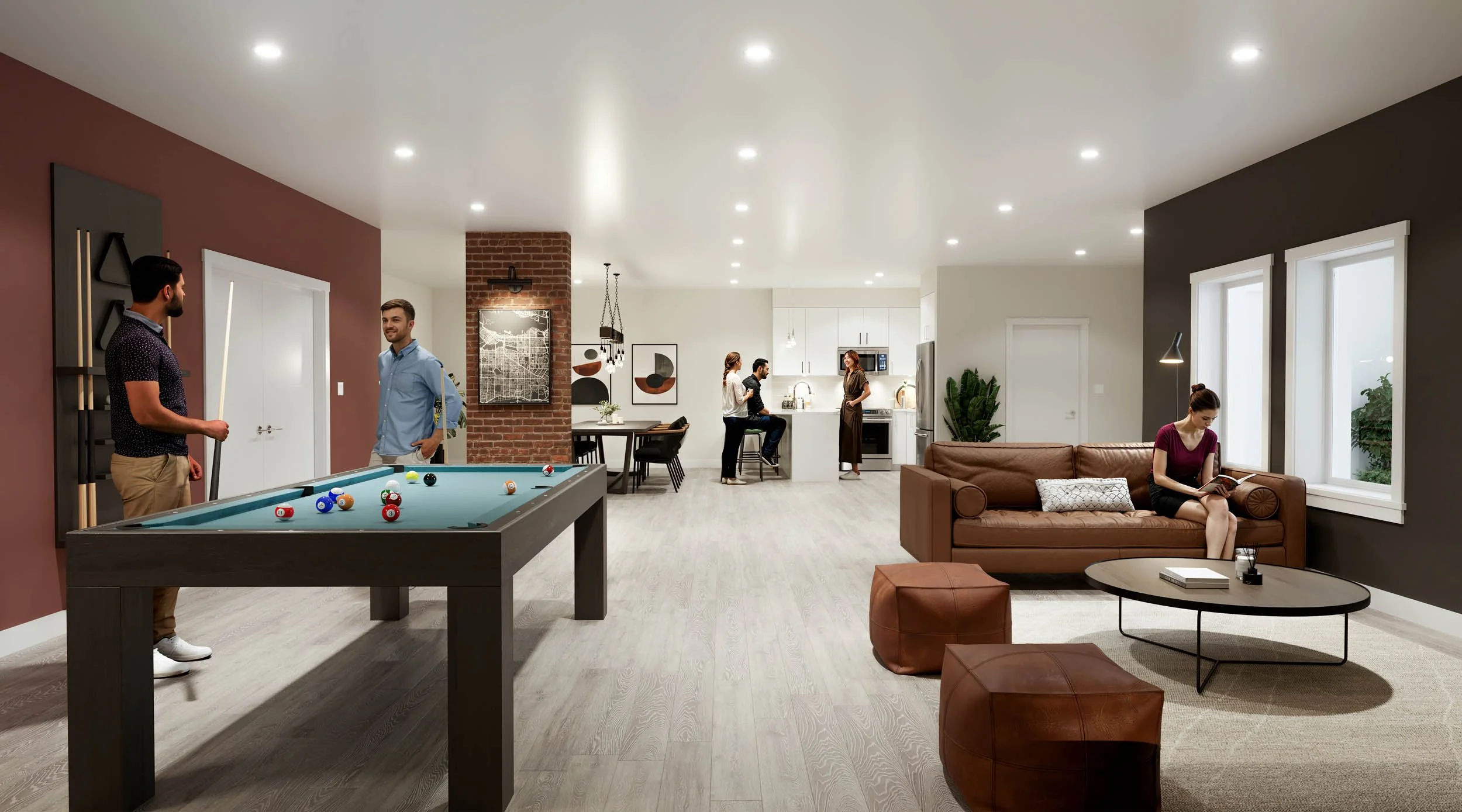 Residents playing pool in an amenity lounge with a brick pier, dark and terracotta walls, and a kitchenette beyond