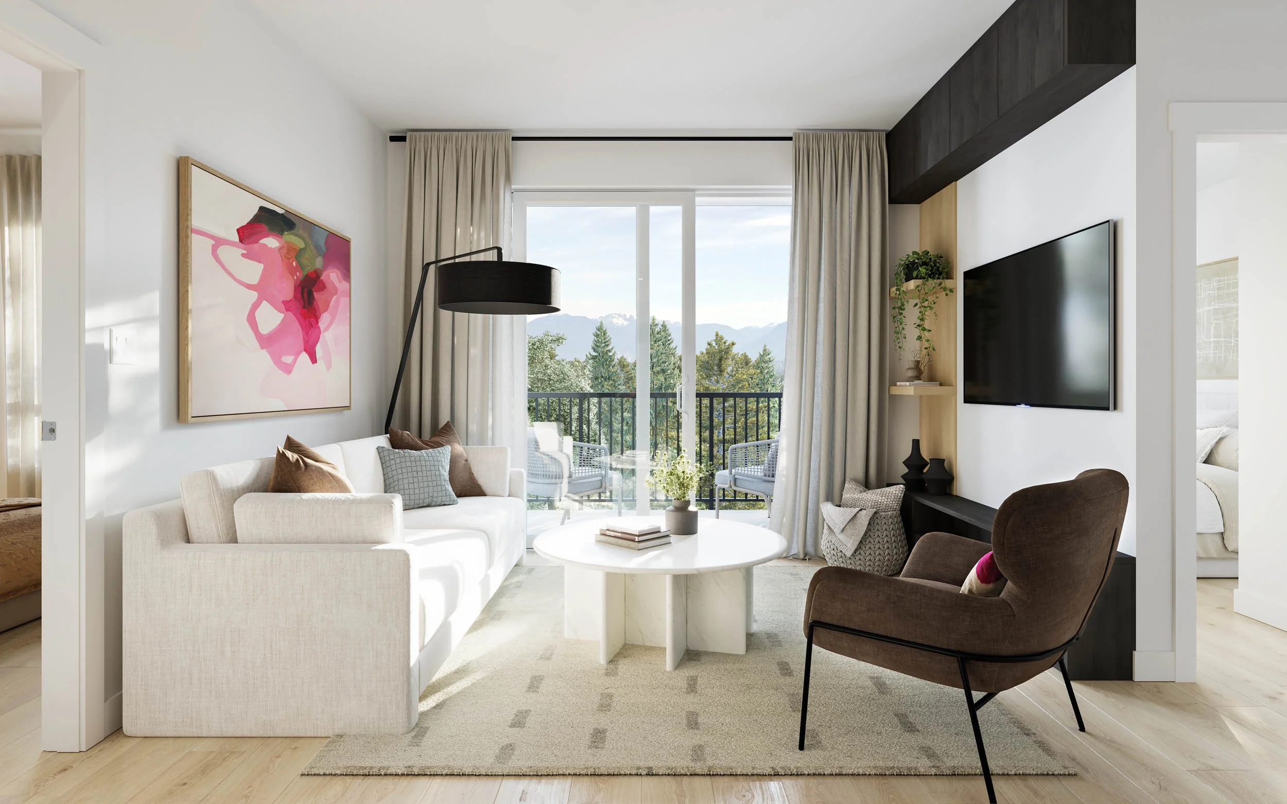 Suite living room with a white sofa, a brown accent chair and a balcony door opening to a distant view