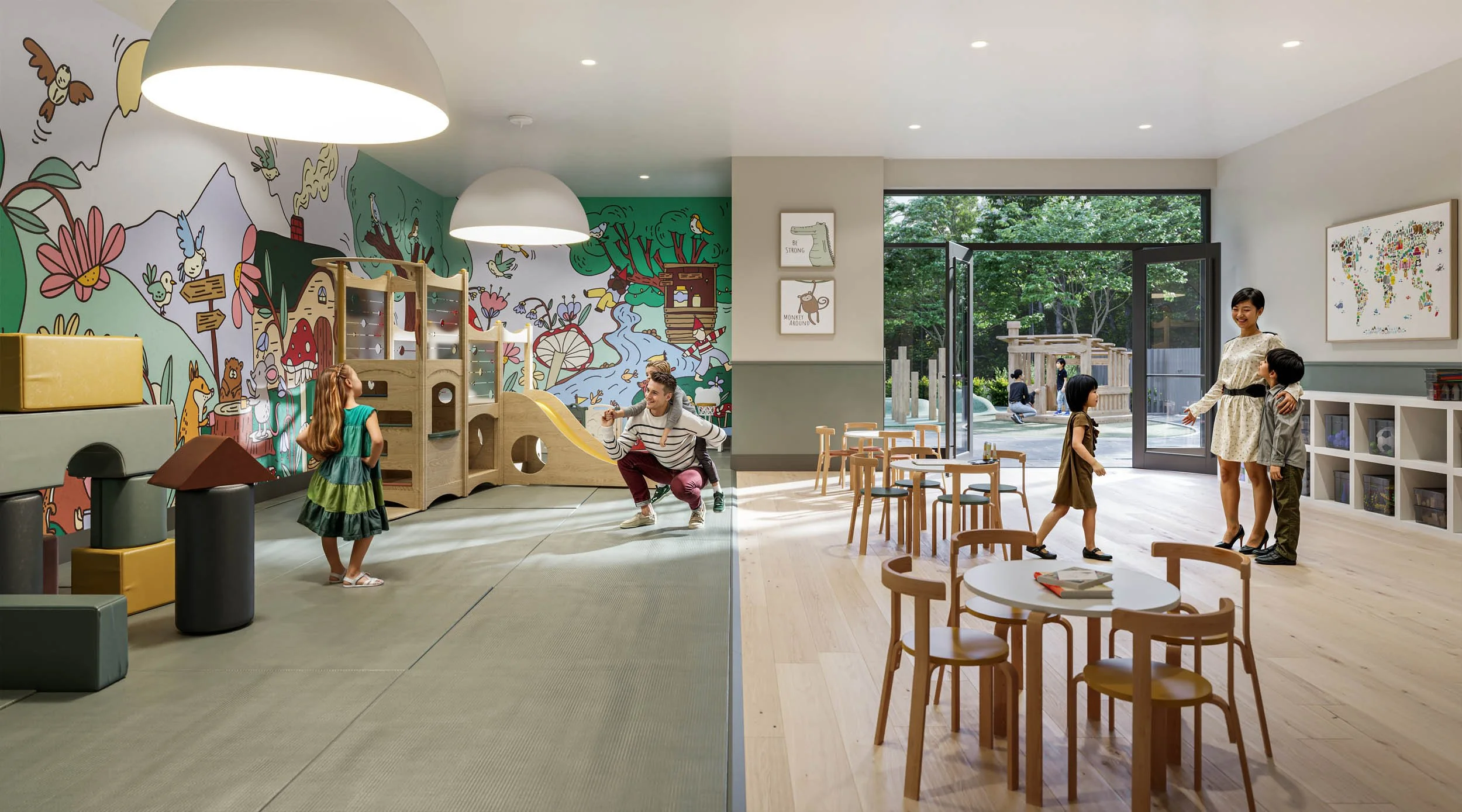 Children playing in a bright playroom with a painted mural wall, a soft play structure and slide, and a wooden table and chairs by the garden doors