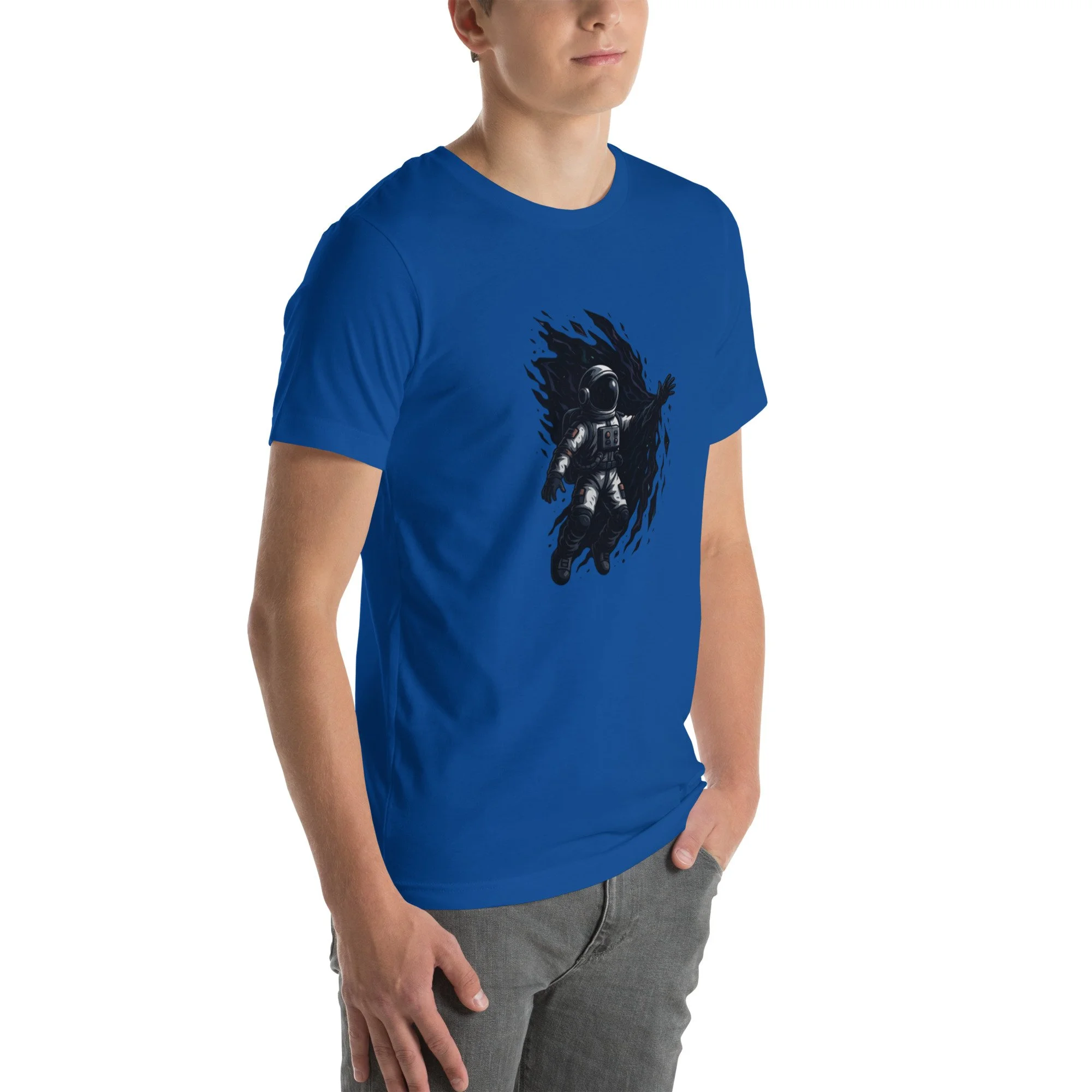 Angled view of royal blue astronaut t-shirt worn by model, featuring Evolvv “Into the Unknown” design on chest.