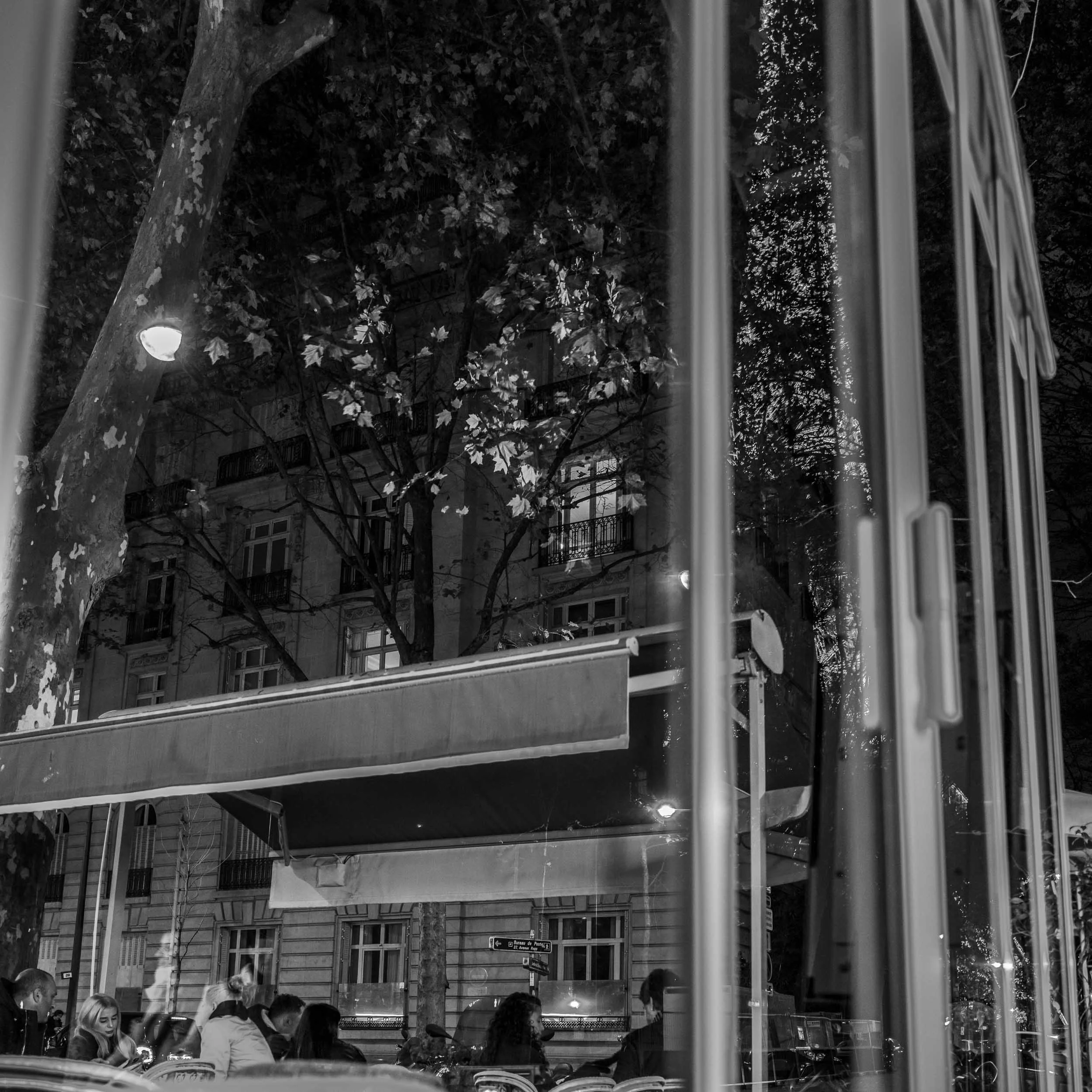 street-paris-restaurant-window-reflection-eiffel-tower-black-and-white.jpg