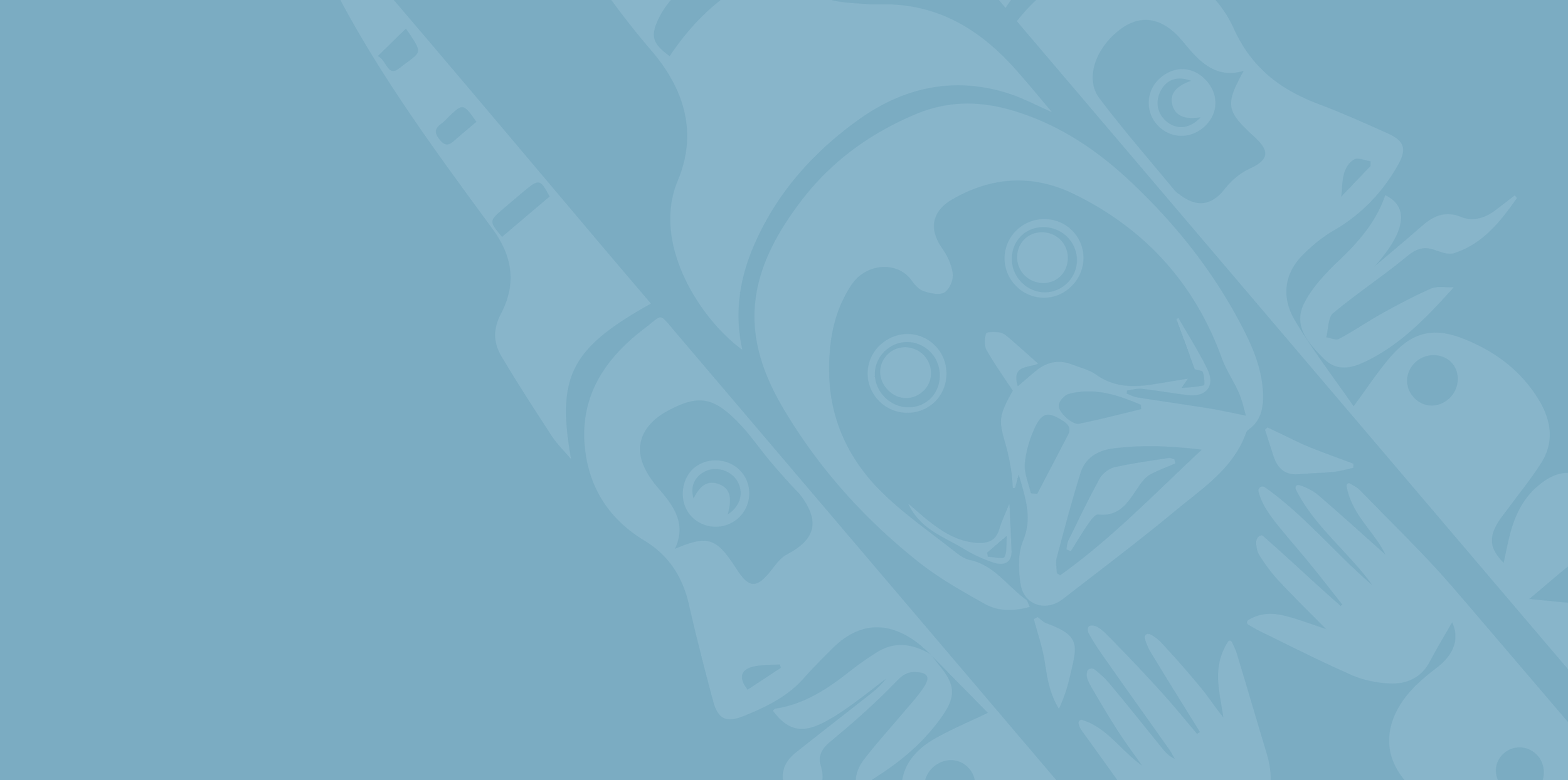 Close-up of a doll's face and hands, made of a shiny material, with a painted face, lying on a surface.