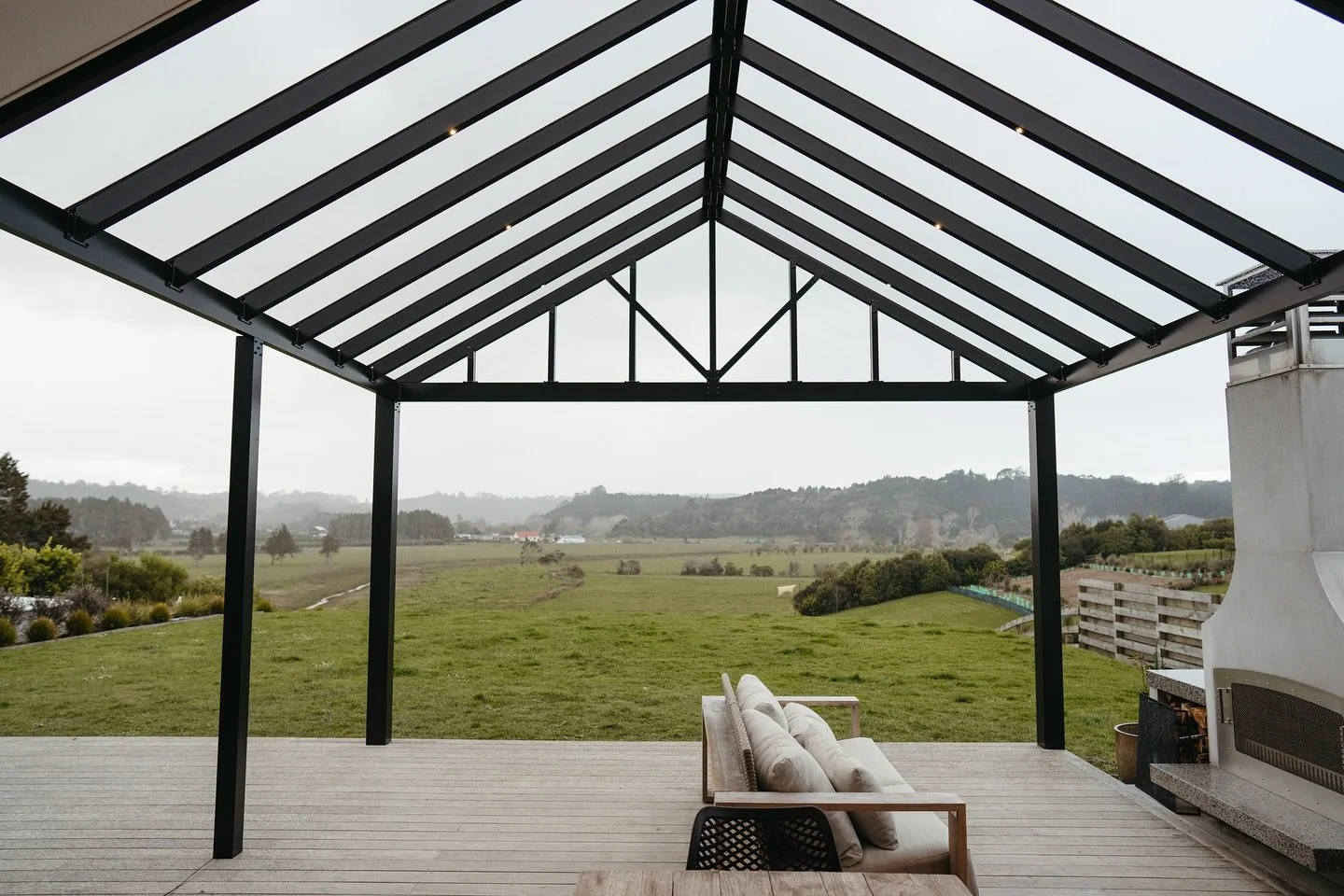 Our stunning gable canopy with integrated LED lighting perfectly frames this idyllic rural view. Soon, we&rsquo;ll be installing screens to fully enclose this beautiful space, making it perfect for any season. We&rsquo;re now taking our final booking