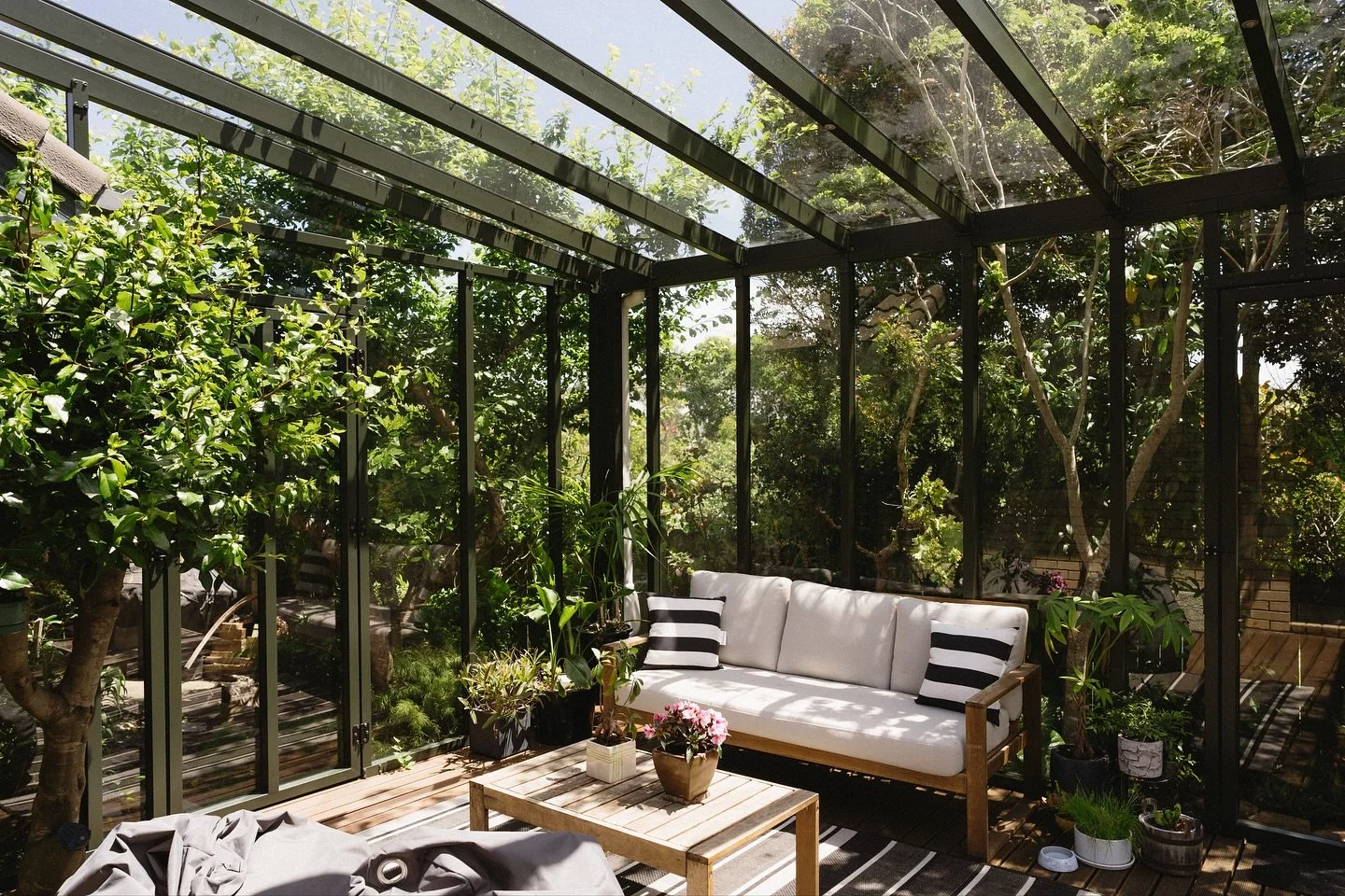 Paradise found 🌳 A fully enclosed outdoor room with doors, a screen, and nothing but ✨ good vibes ✨