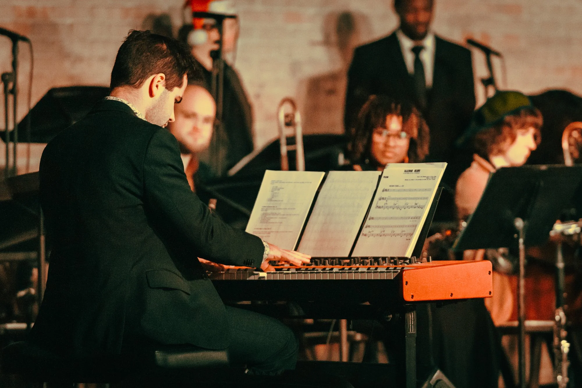 Matthew Zelenin playing piano for a ballet production of Duke Ellington's Nutcracker put on by ATX Artists for Social Impact.