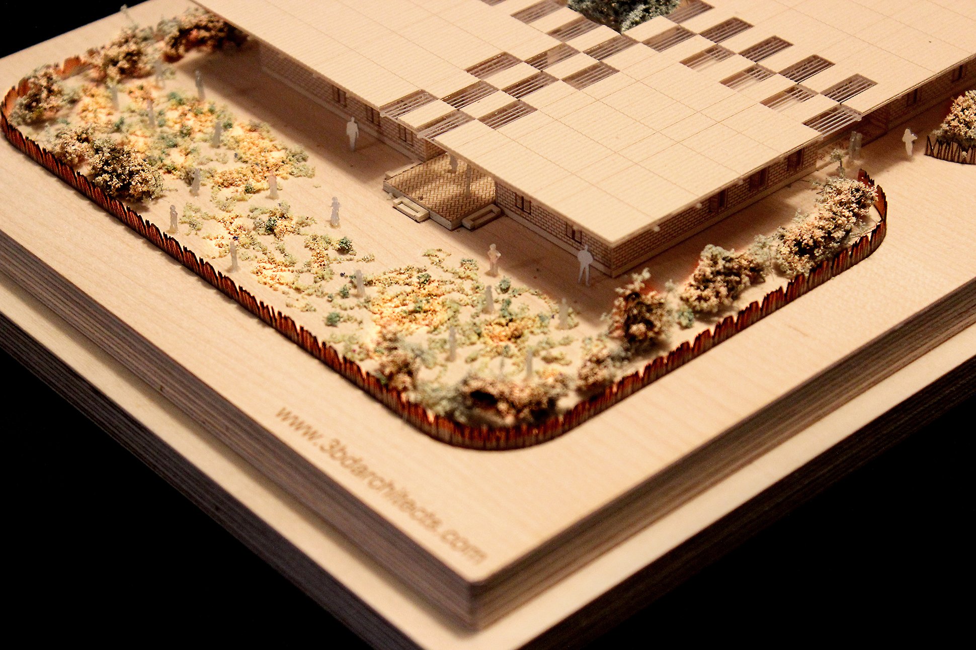 Closeup garden photograph of a 1 to 200 scale physical wood model of a Modular School Concept for in the Katanga region of the Democratic Republic of Congo by 3bd Architects.jpg