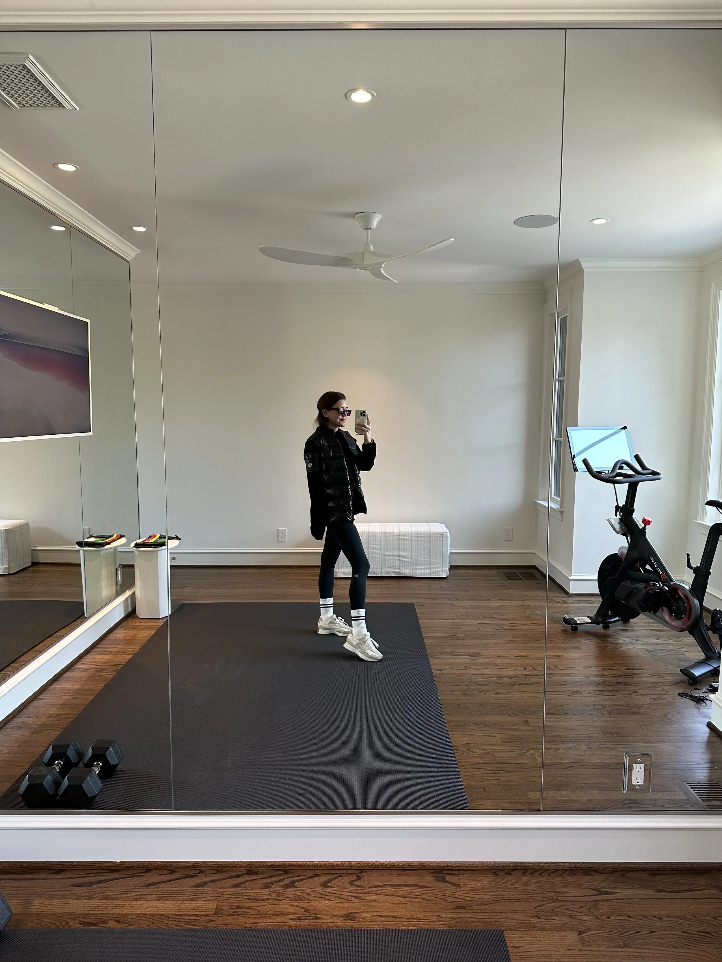 amy havins wearing a moncler jacket and alo leggings