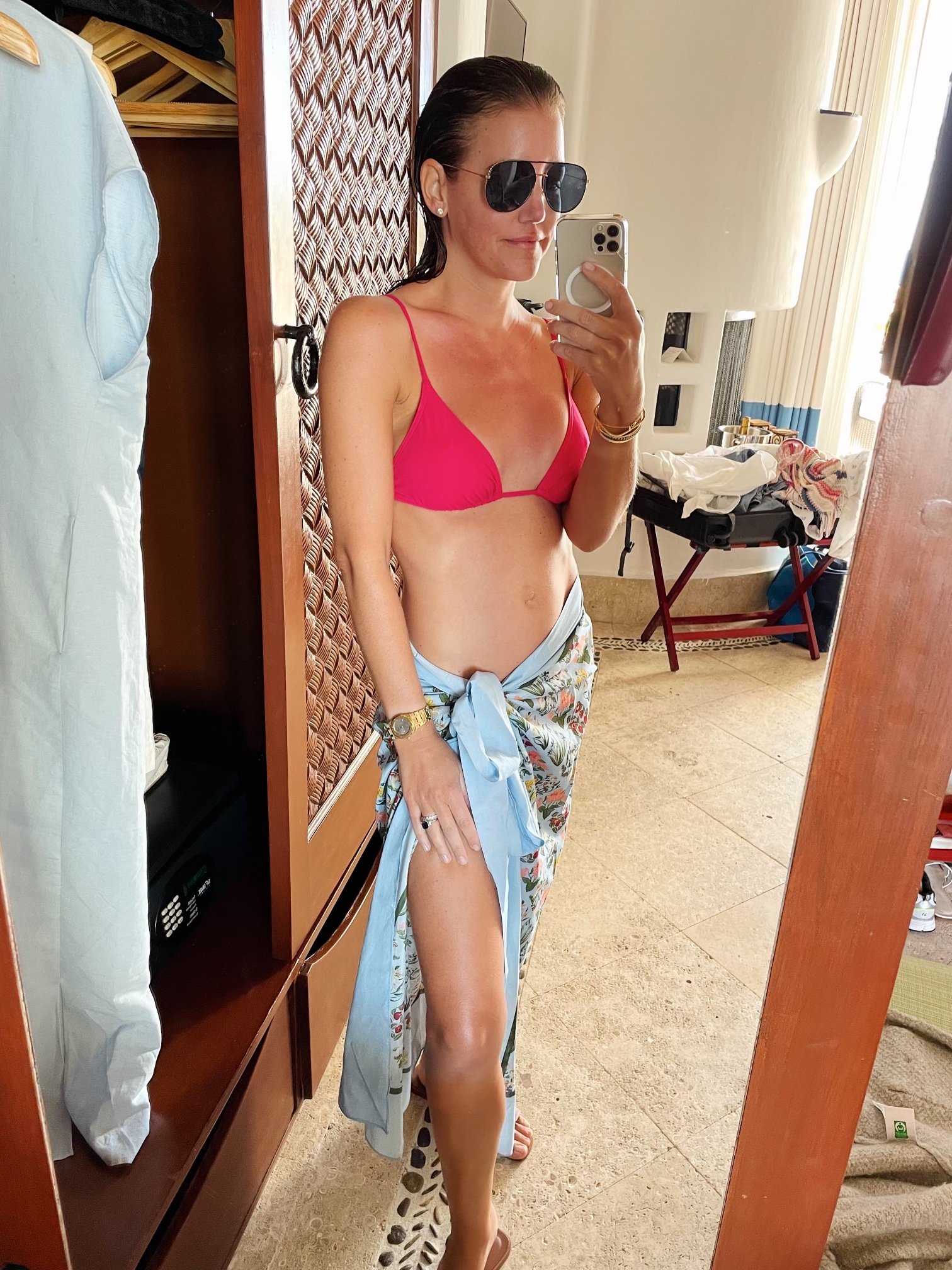 amy havins wearing a pink eres bikini with louis vuitton sunglasses