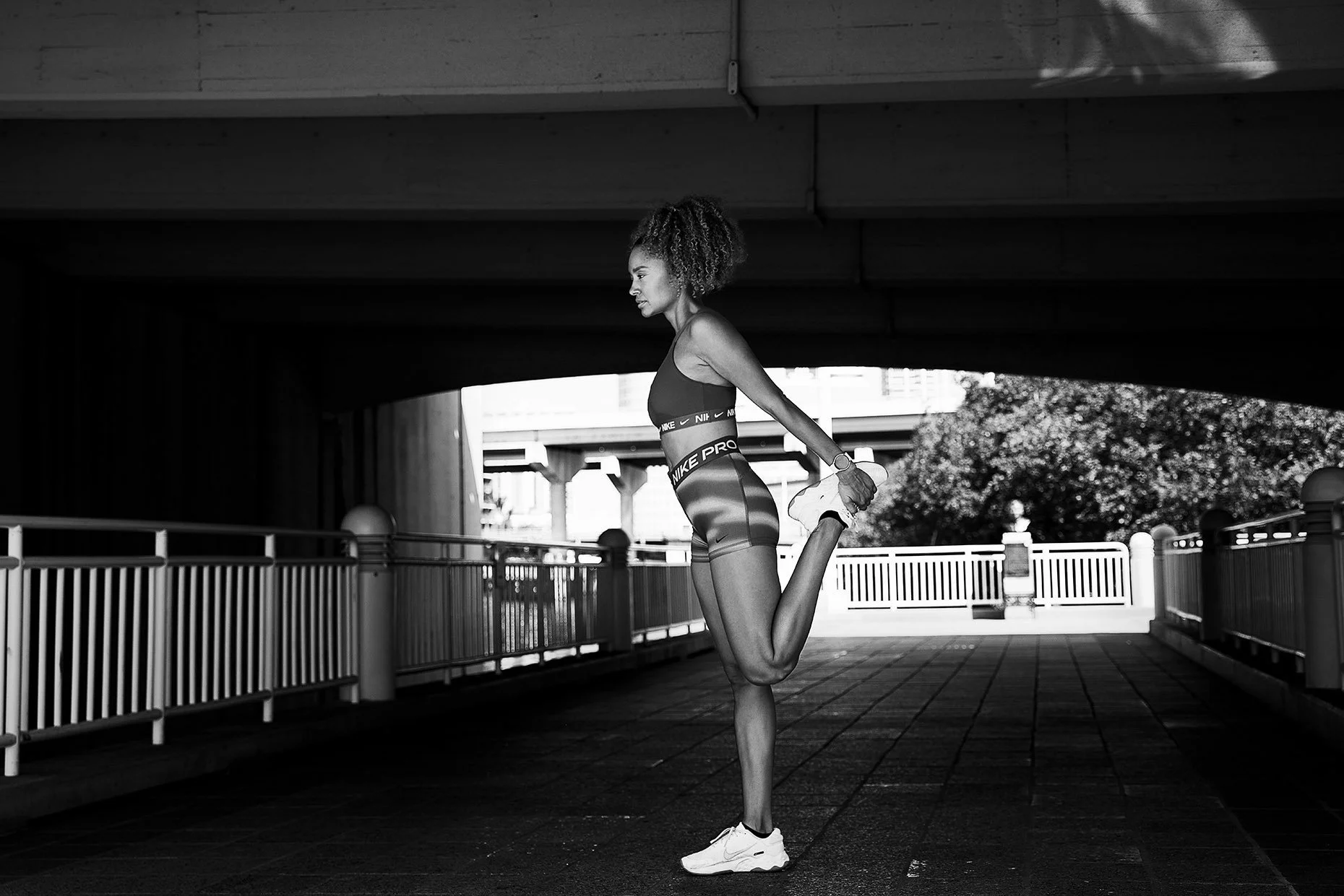James-Acomb-photographer-black-and-white-image-of-woman-stretching.jpg