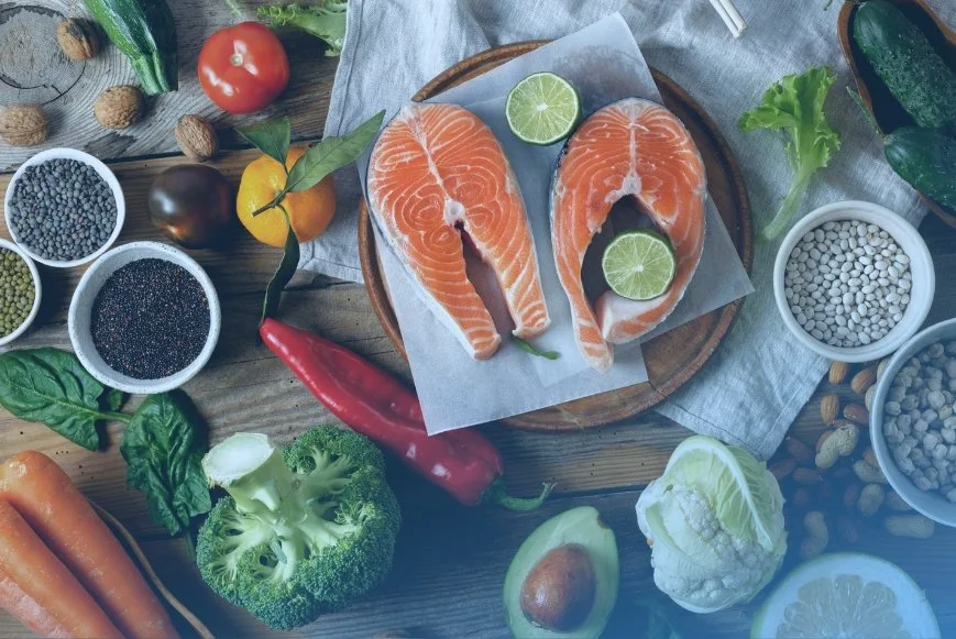 Healthy foods on a counter representing steps to retrain your pallet for better metabolism from DexaFit West Houston, TX