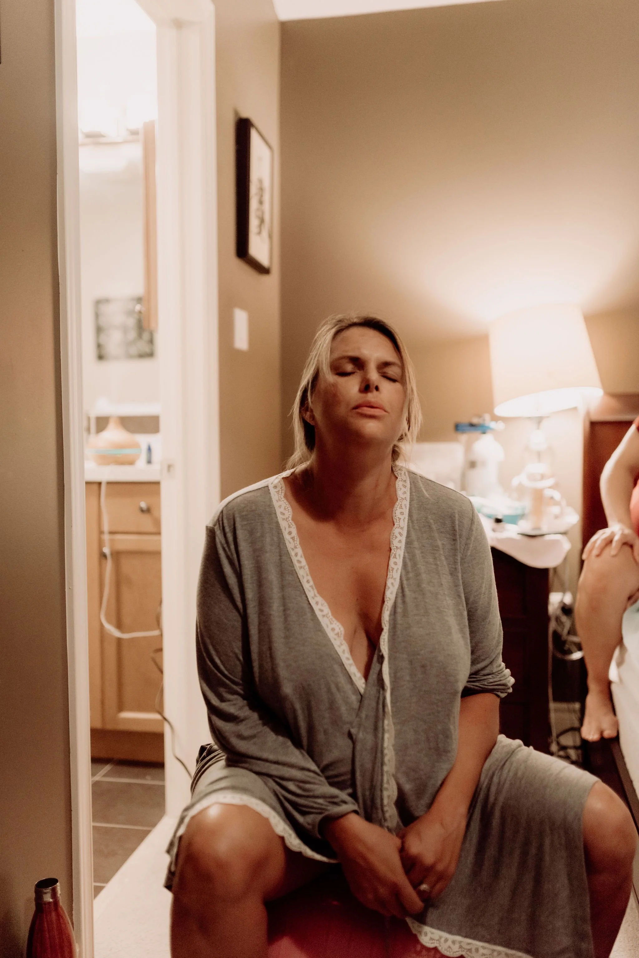 A woman labors at home on a birth ball