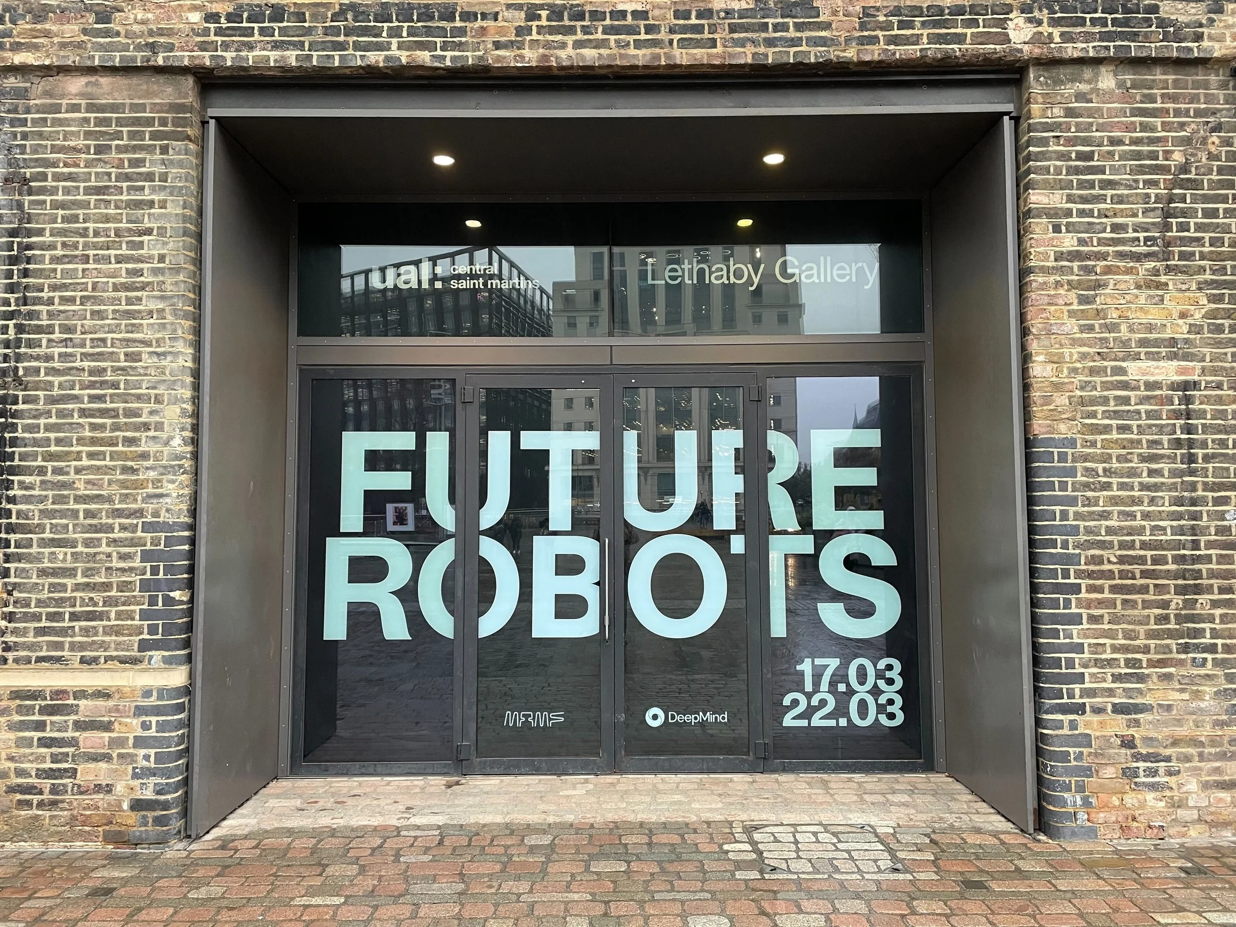 a photo of the front doors of the future robots exhibition