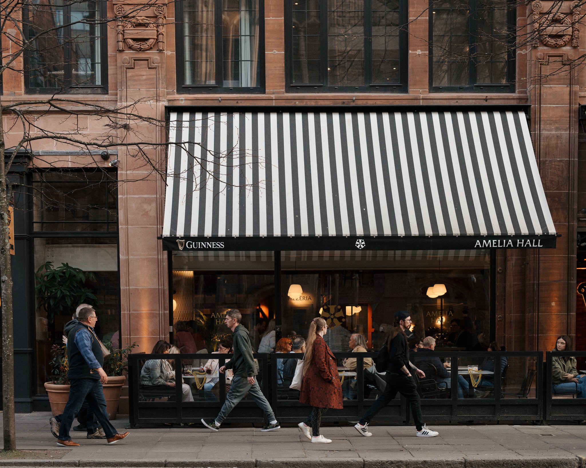 Amelia Hall’s striped awning and outdoor terrace on Howard Street in Belfast’s Linen Quarter.