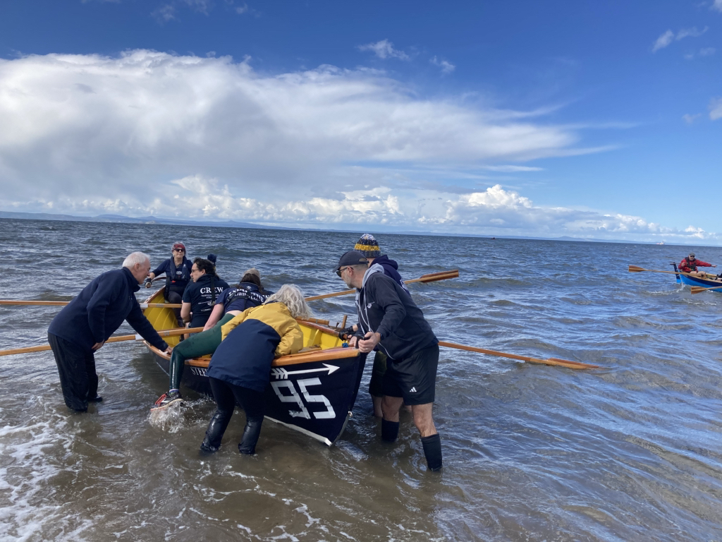  Eskmuthe prepares to launch from the beach in the running/rowing open mixed race.&nbsp; 