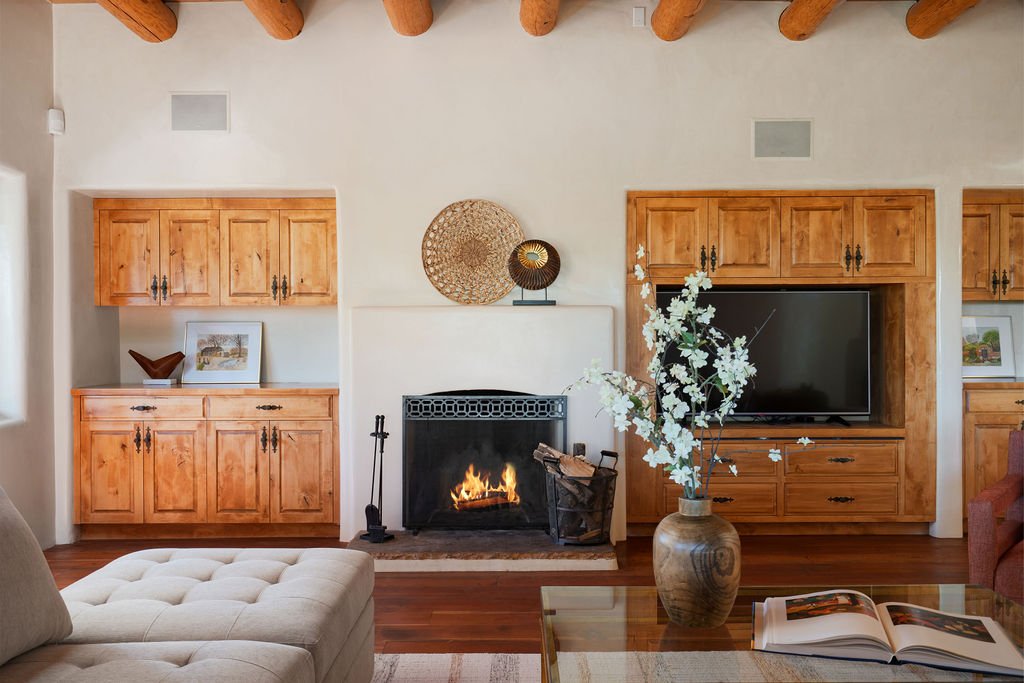 grand living room Santa Fe built ins vigas fireplace