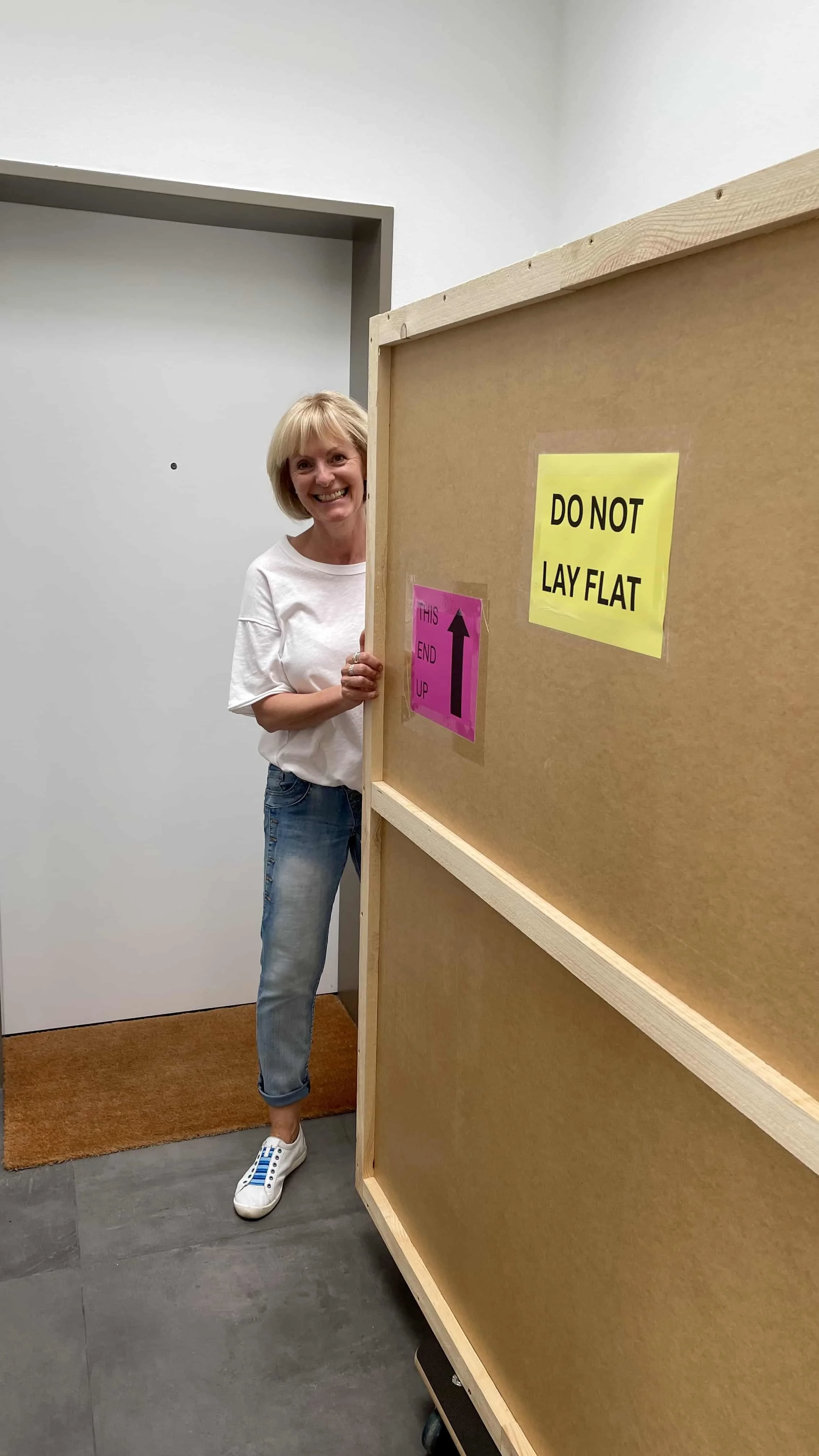 Claudia with the fully crated artwork, ready for shipping