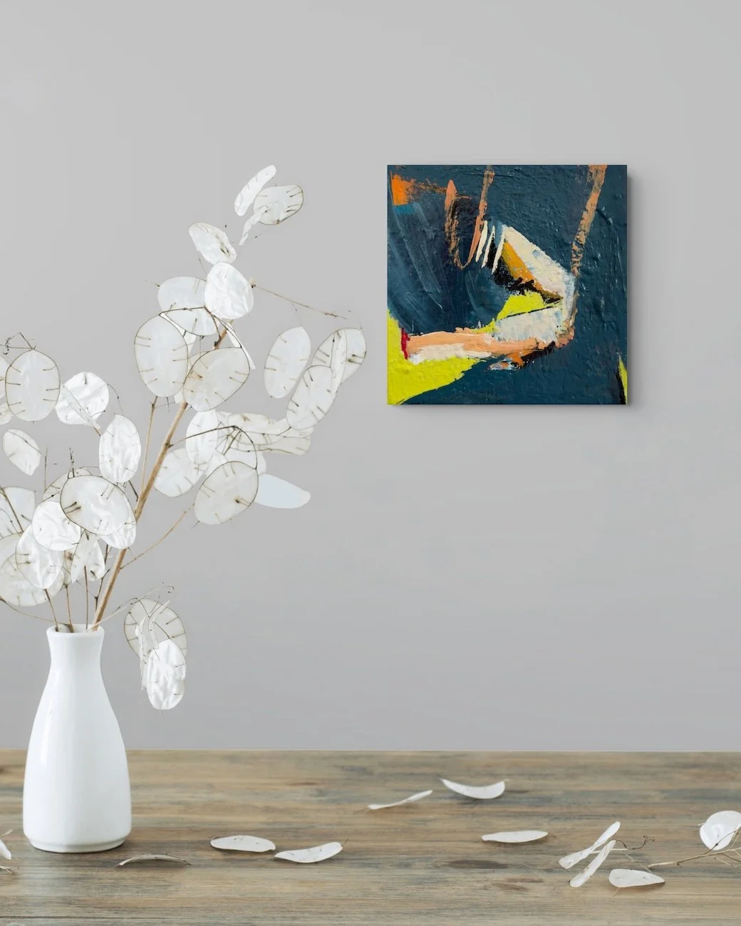 Reaching - In Situ with art hanging above a small table