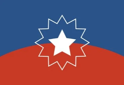Juneteenth flag: Upper half is blue and lower half is red. Colors are divided by a horizontal arch. In the center is a white star, which is outlined.
