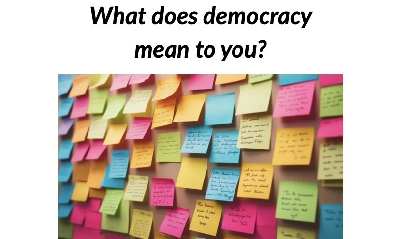 Board of colorful sticky notes with the text above: What does democracy mean to you?