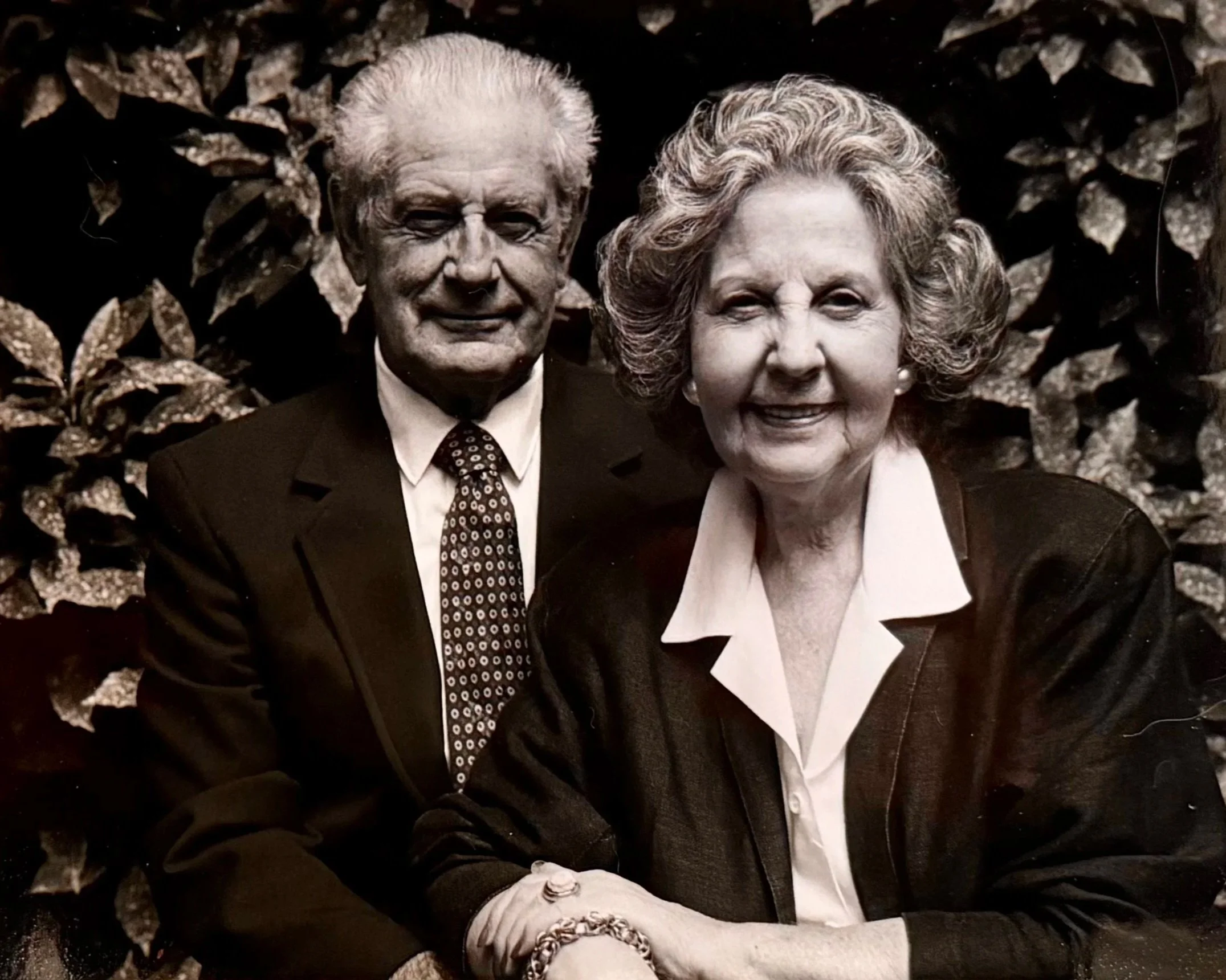 My parents, Josephine and Louis pausing for a quick photograph — jackets and ties concealing the garden overalls beneath. They took a break from gardening so I could do one snapshot!