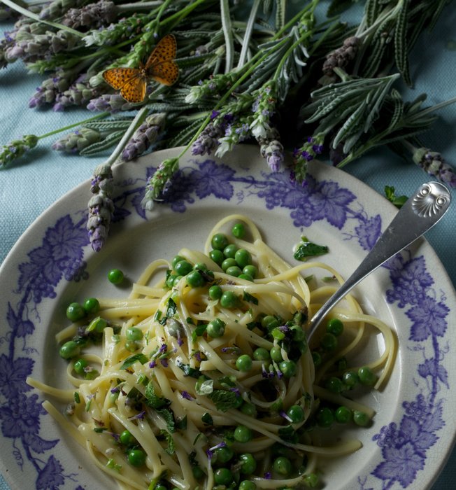 Paulette Tavormina for The Beekman 1802 — Peas and linguini dish with sprigs of lavender from The Beekman 1802 Heirloom Cookbook, photographed in her signature Old Master-inspired still life style.