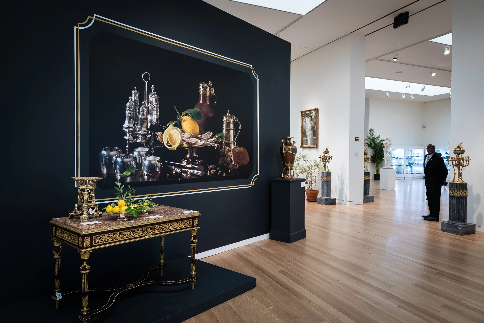 Paulette Tavormina for Sotheby’s — From LUXE: The Art of the Table, a still life in her Old Master style featuring silver works of art, lemons, greenery, and ornate decor on display in Sotheby’s 10th floor gallery.