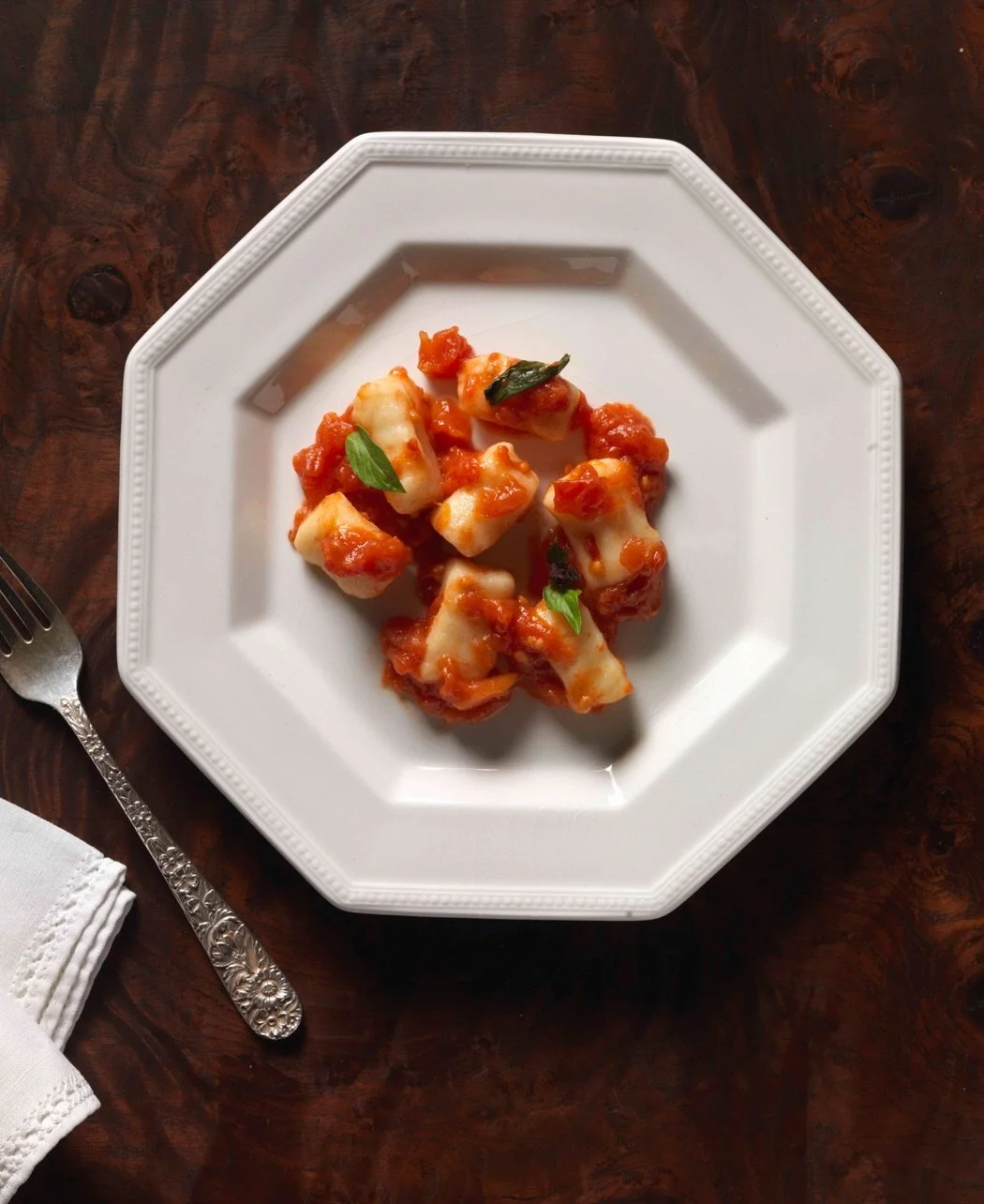 Paulette Tavormina for The Del Posto Cookbook — Still life of “Batali’s grandma’s potato gnocchi,” a classic dish featured in the cookbook.