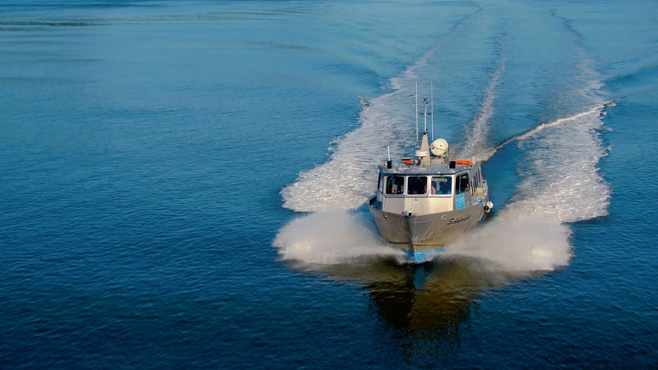 Aerial drone view of a water taxi during a commercial production in the Southern Gulf Islands