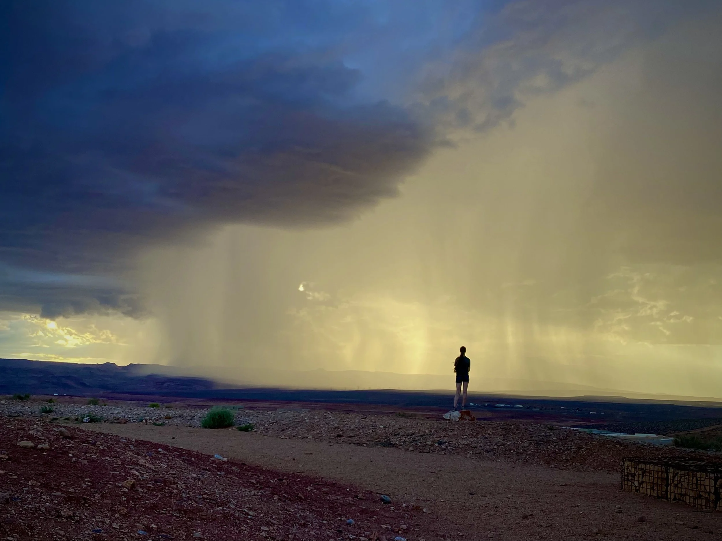 Desert panorama with cloudburst rain in the distance from Grandview Knoll Trail