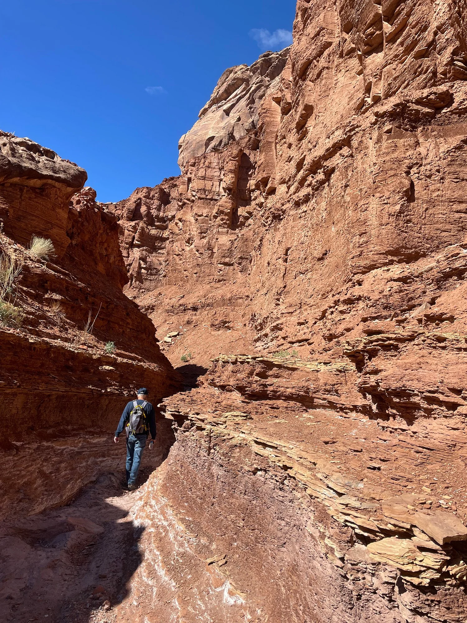 Hiker walks into narrow canyon in Upper Cathedral Wash