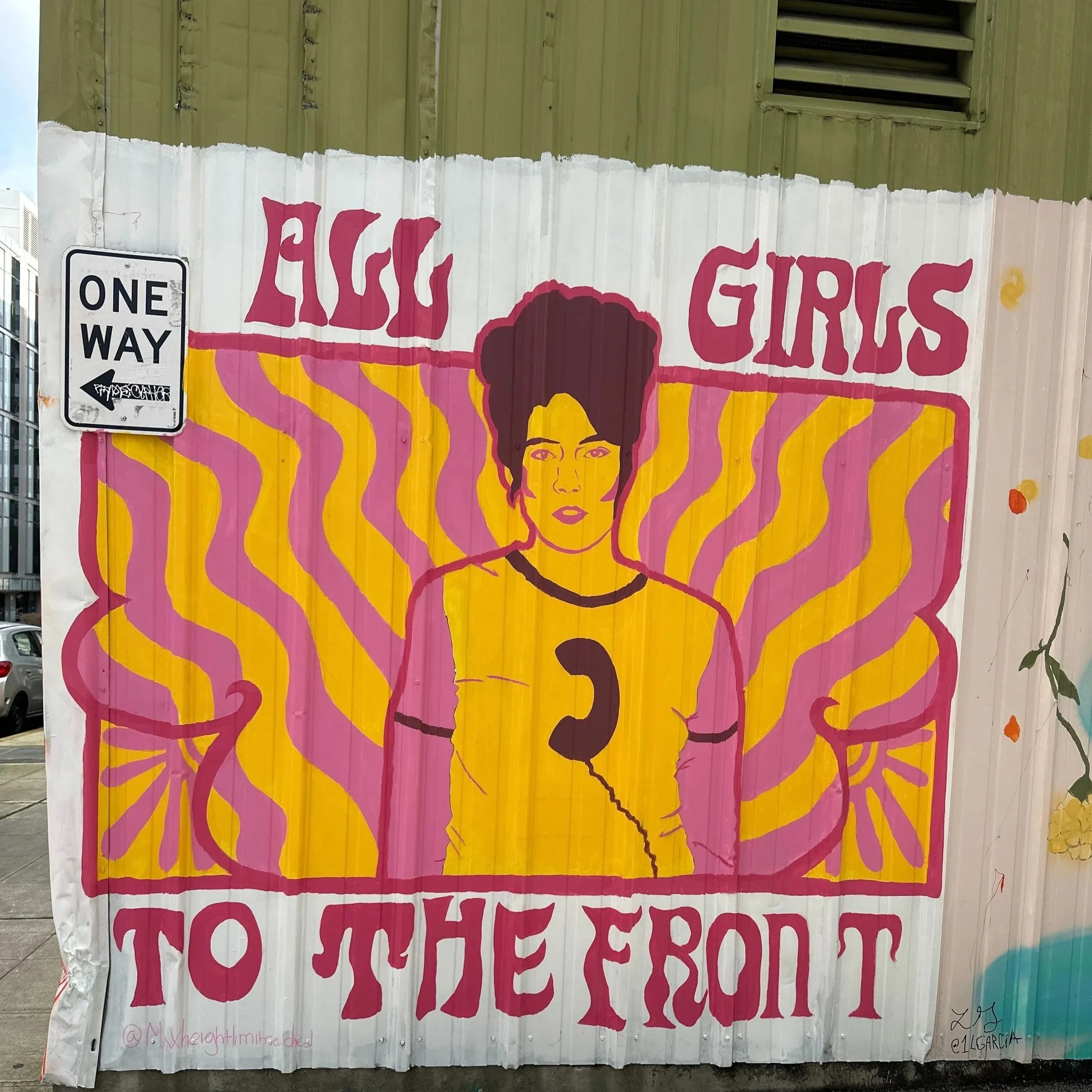mural saying "all girls to the front"