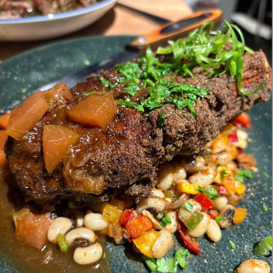pork chop dish with assorted accompaniments