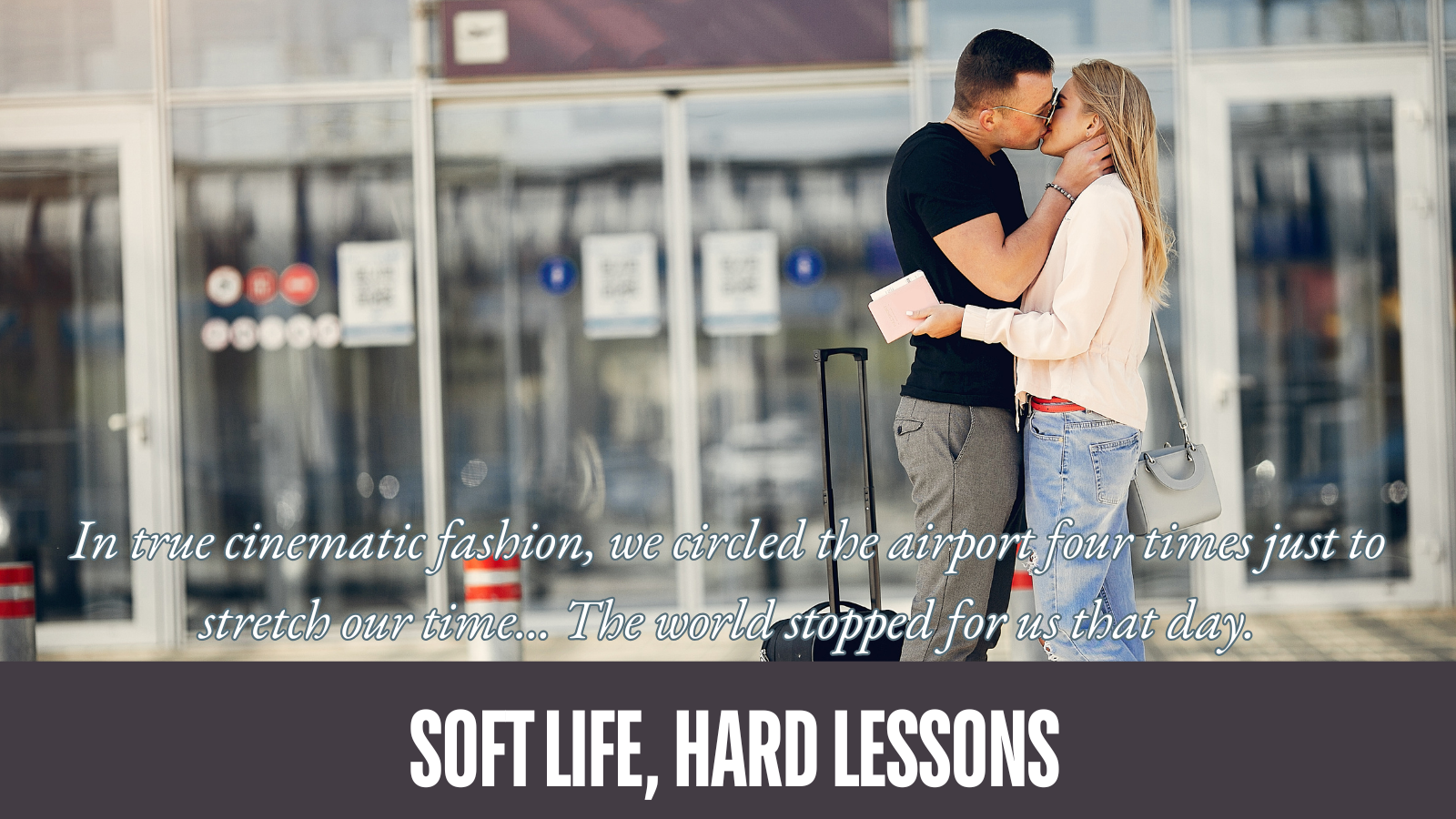 A white man and woman kiss near the front entrance to an airport. White letter overlay.