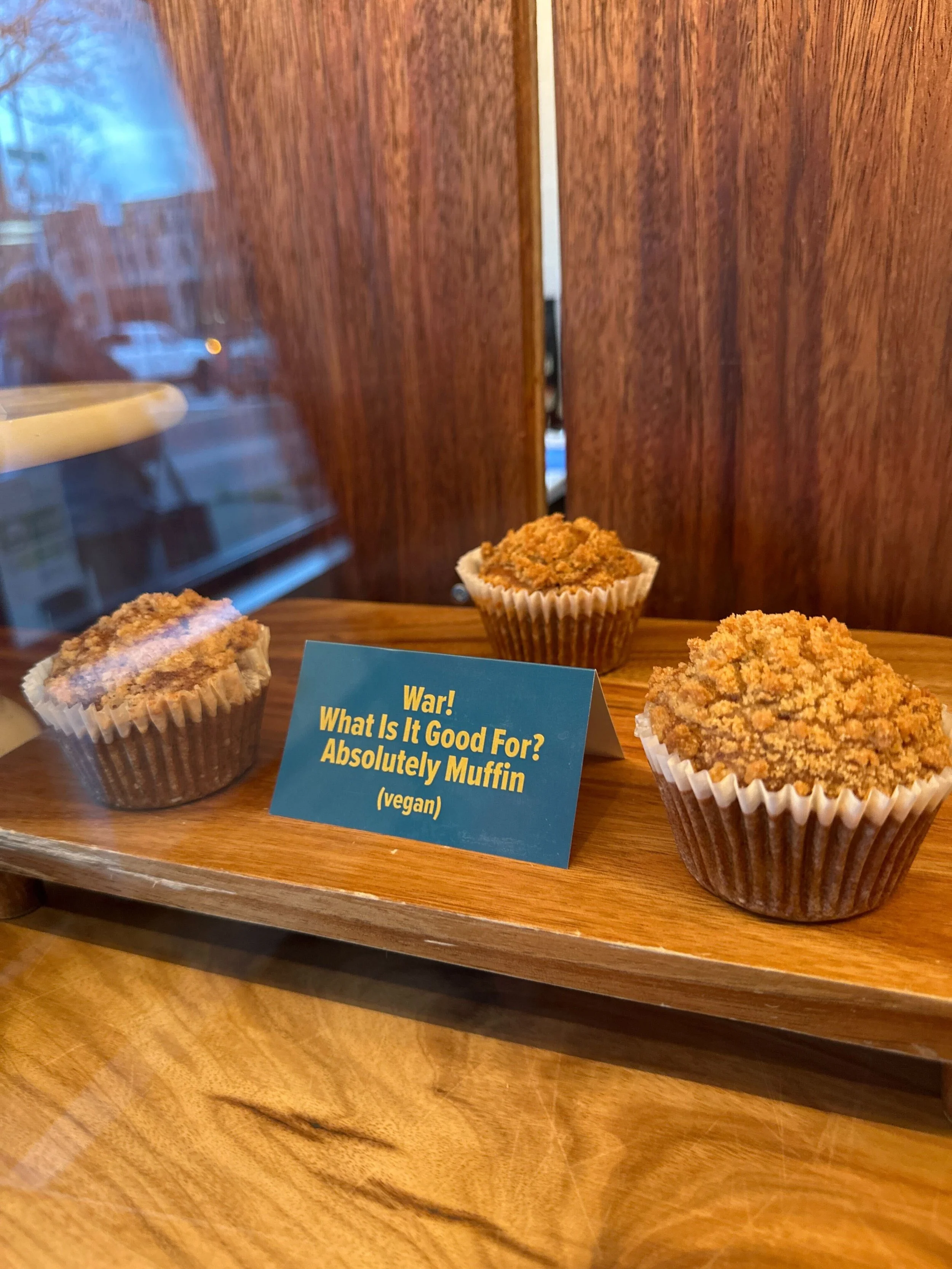 muffins with a placard "war! what is it good for? Absolutely muffin"