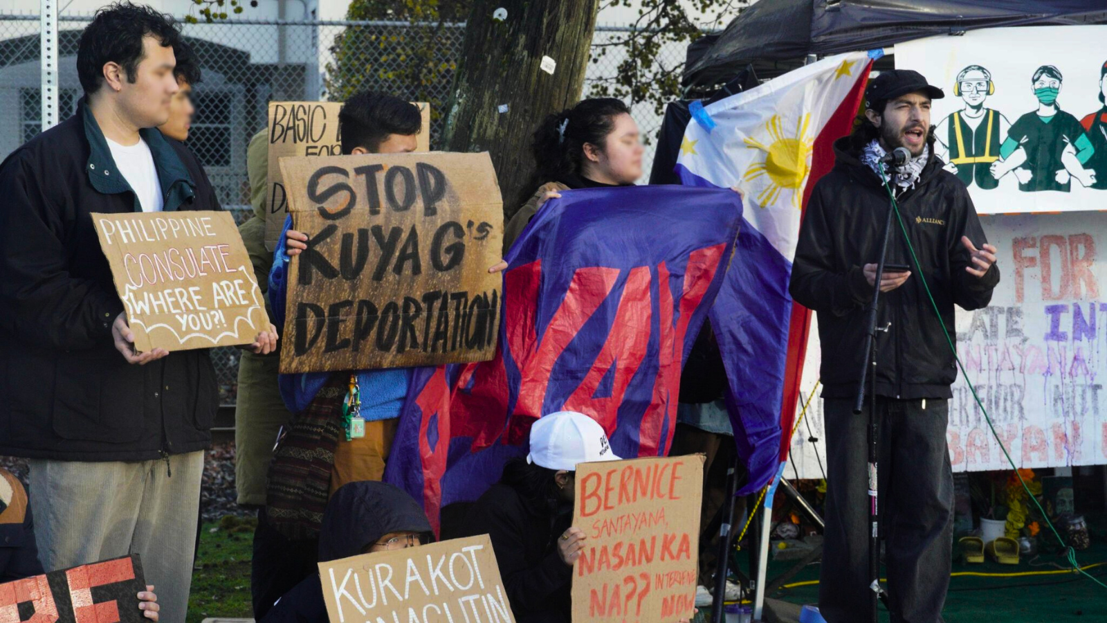 a group of protestors with signs rallying for Kuya G and CTA for the Phillipine Consulate to take action
