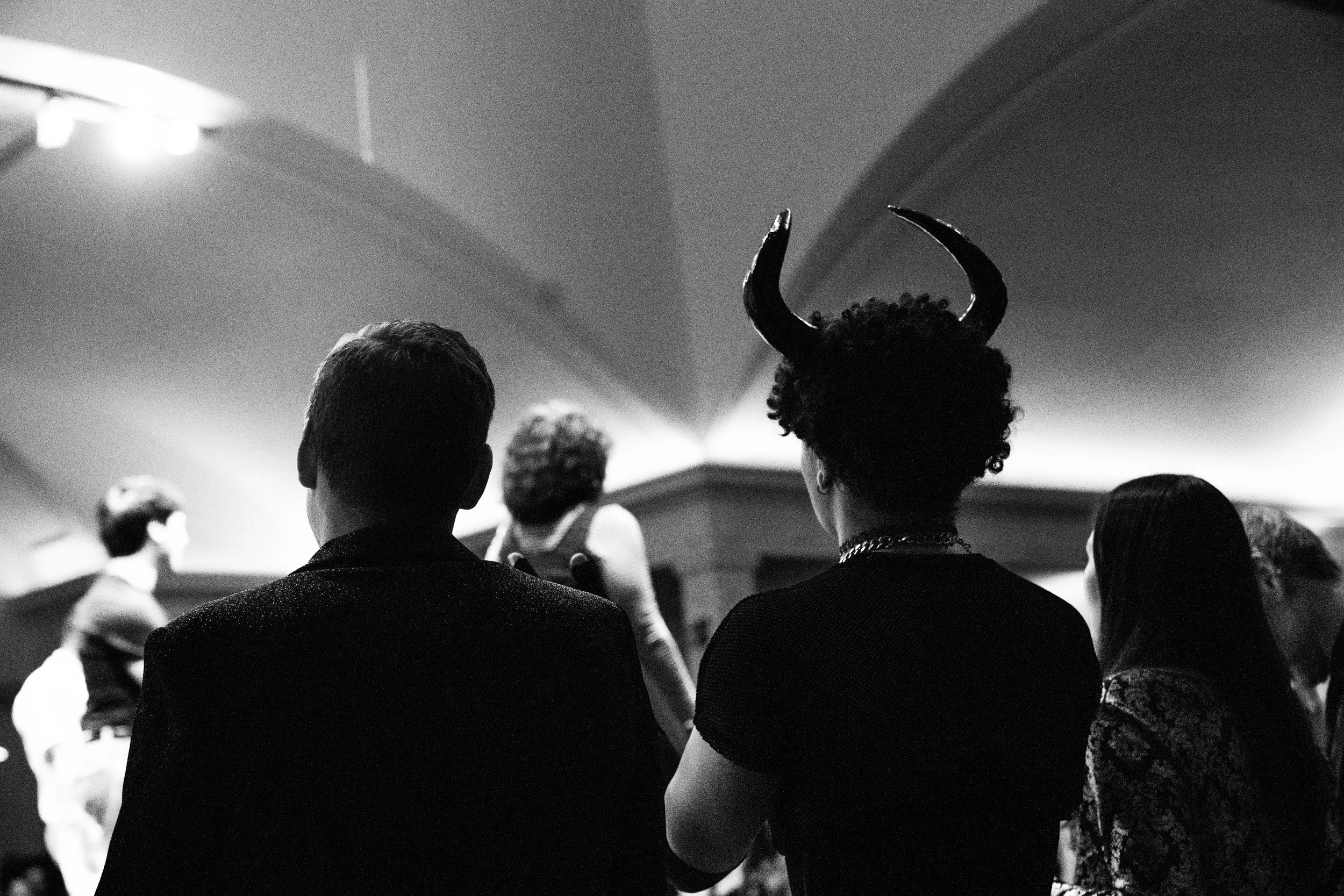 heads of folks looking to the stage