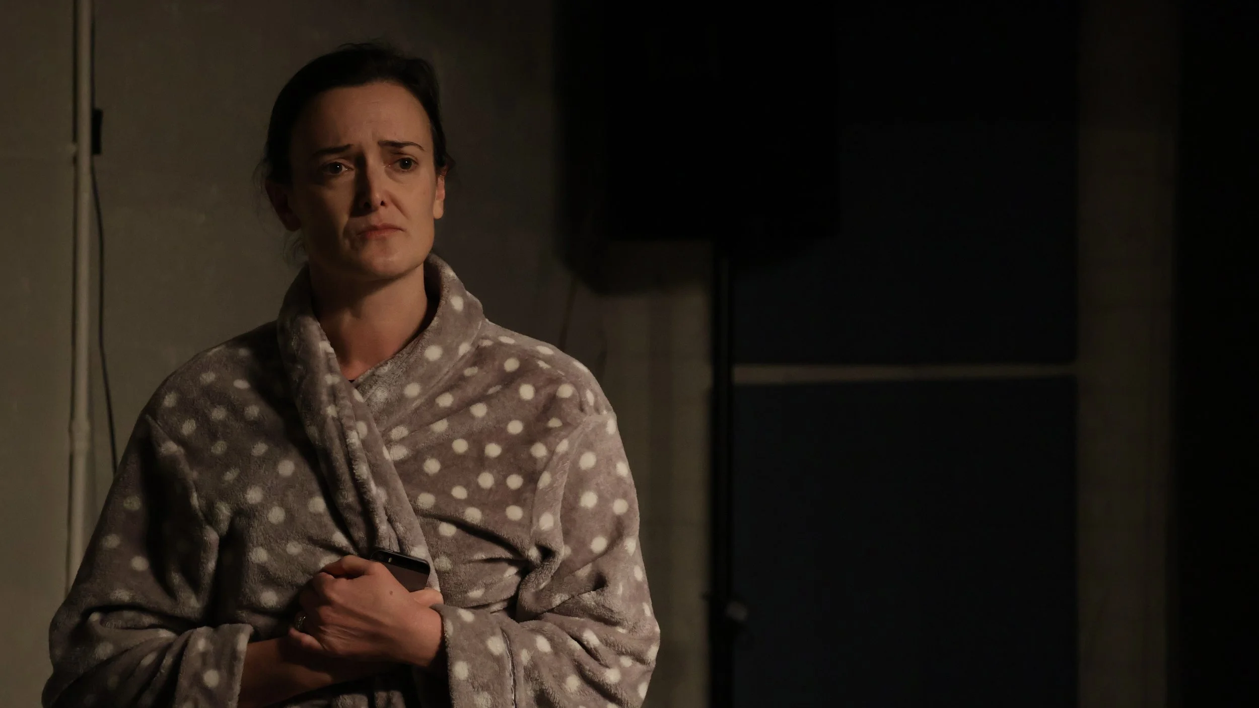 Helen holding her robe closed