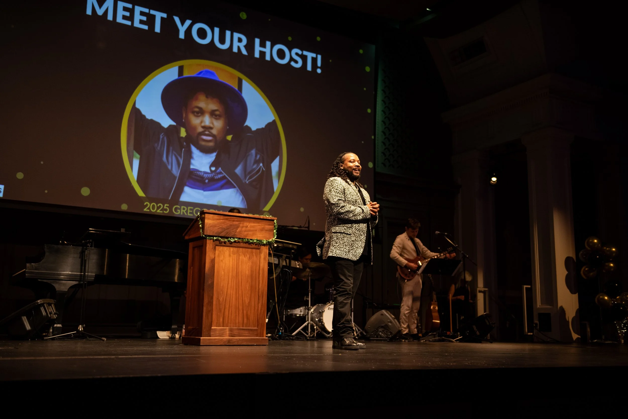 Jimmy Shields on stage as host of The Gregorys