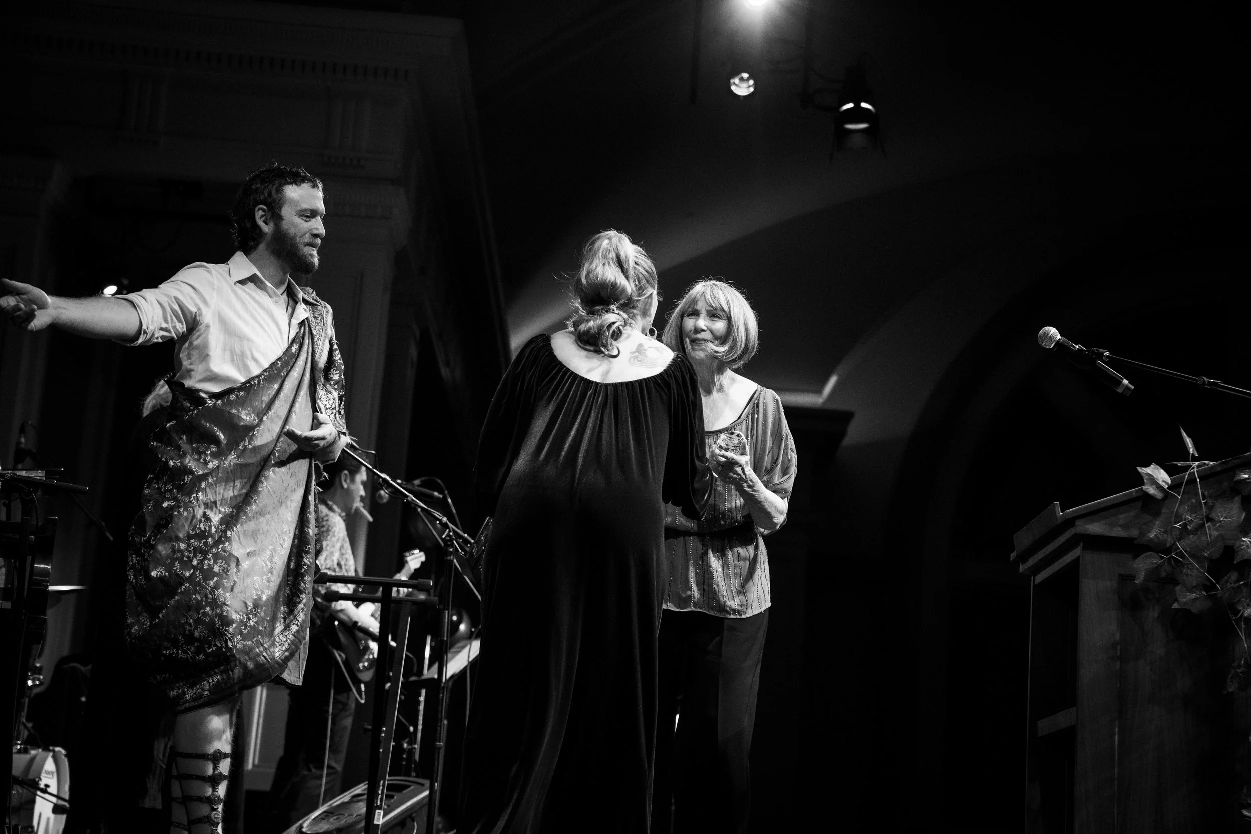 woman receiving award on stage