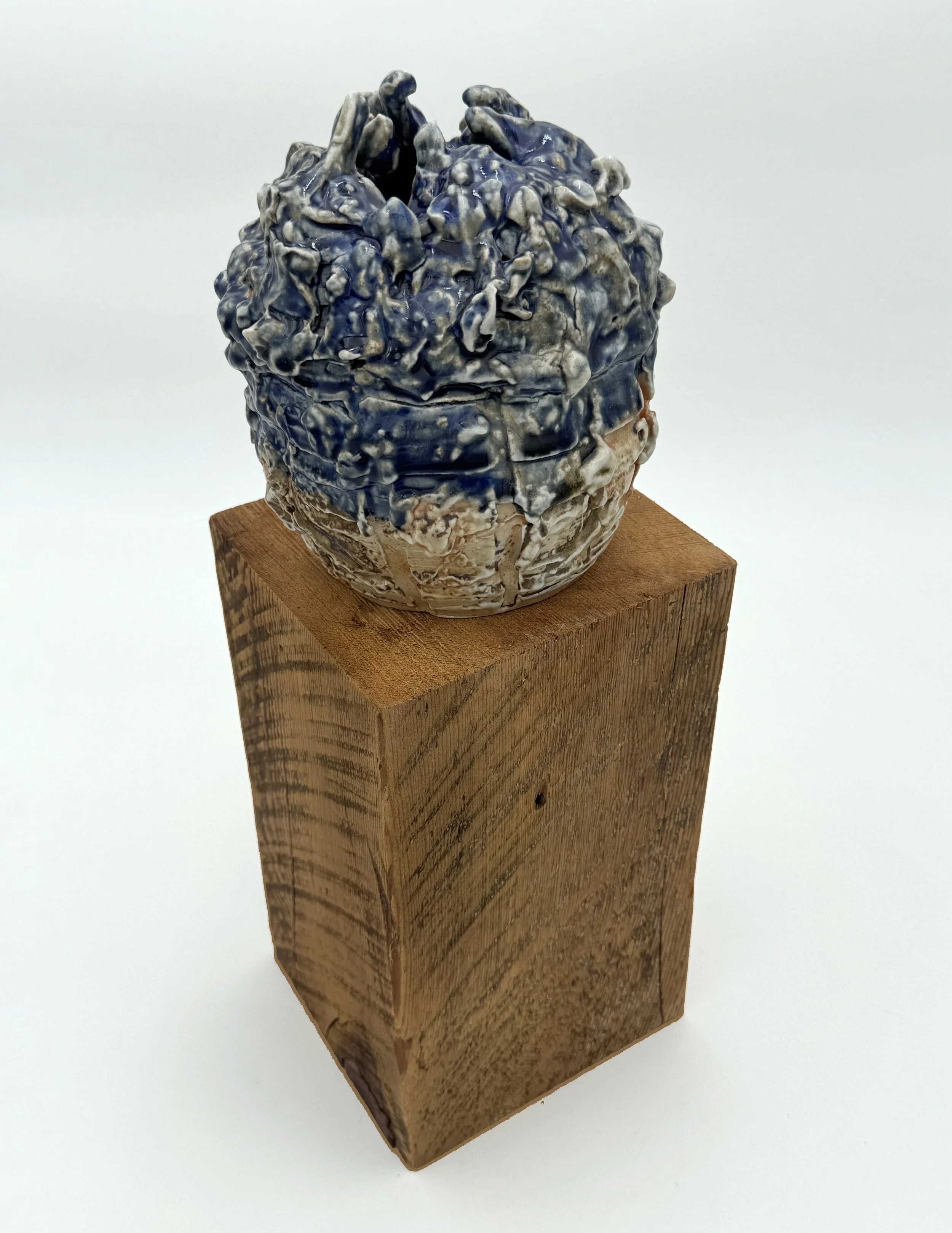 Collapsed (SC SF), 2025. Stoneware and wood. 5 1/2 x 18 1/2 x 6"