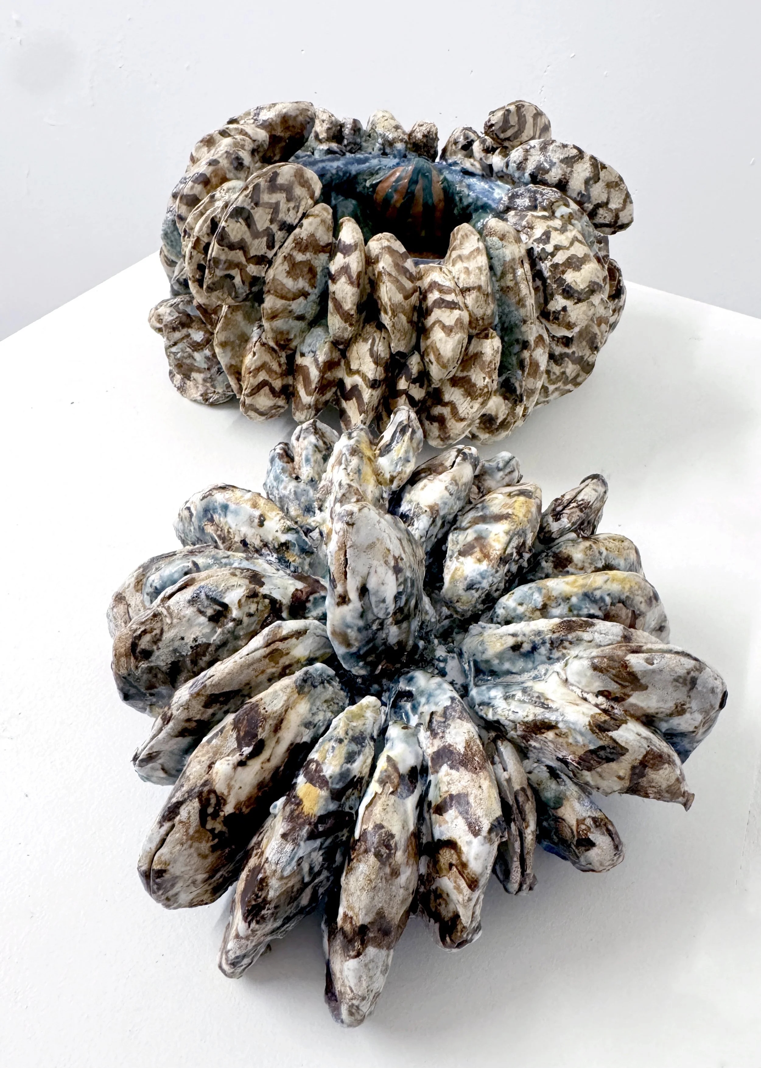 Zebra Mussels, 2025. Stoneware. 2-part piece: the bottom pot is 9" wide x 4 3/4" tall; the lid is 4 1/2" tall x 7 1/2" wide (outside of lid shown)