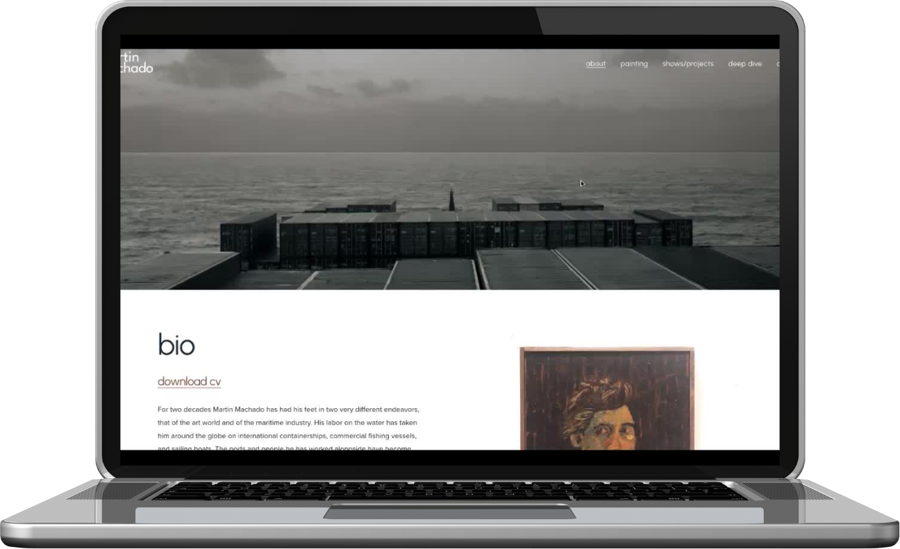 A laptop screen displaying an art website with a black and white photo of a seascape at the top, followed by a section with the title 'bio' and a paragraph of text below, along with a small portrait painting of a woman's face.
